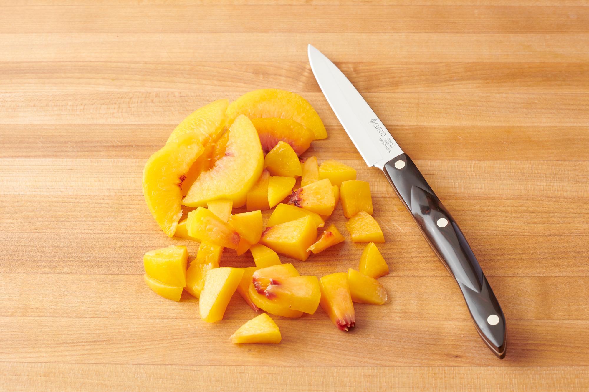 Use a 4 Inch Paring Knife to dice the peach.