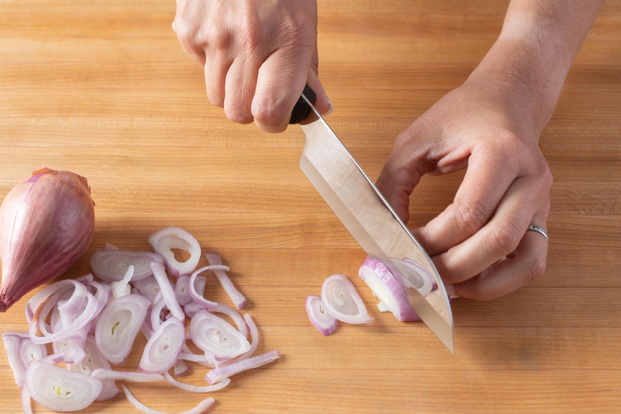 The Petite Santoku is perfect for thinly slicing the onion.
