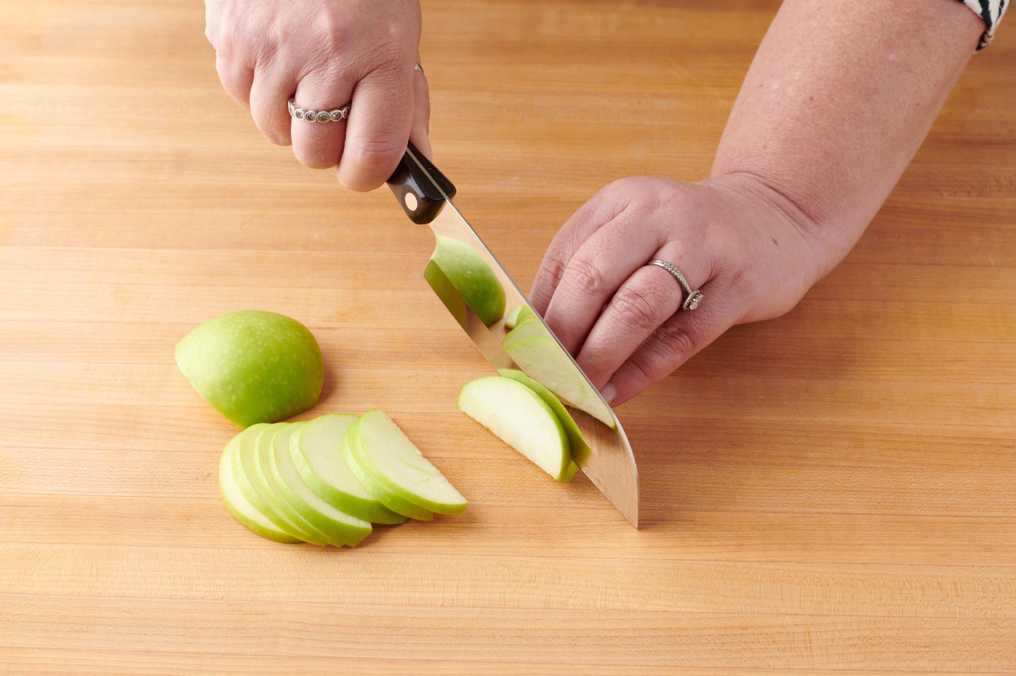 Slicing apples with a Petite Santoku.