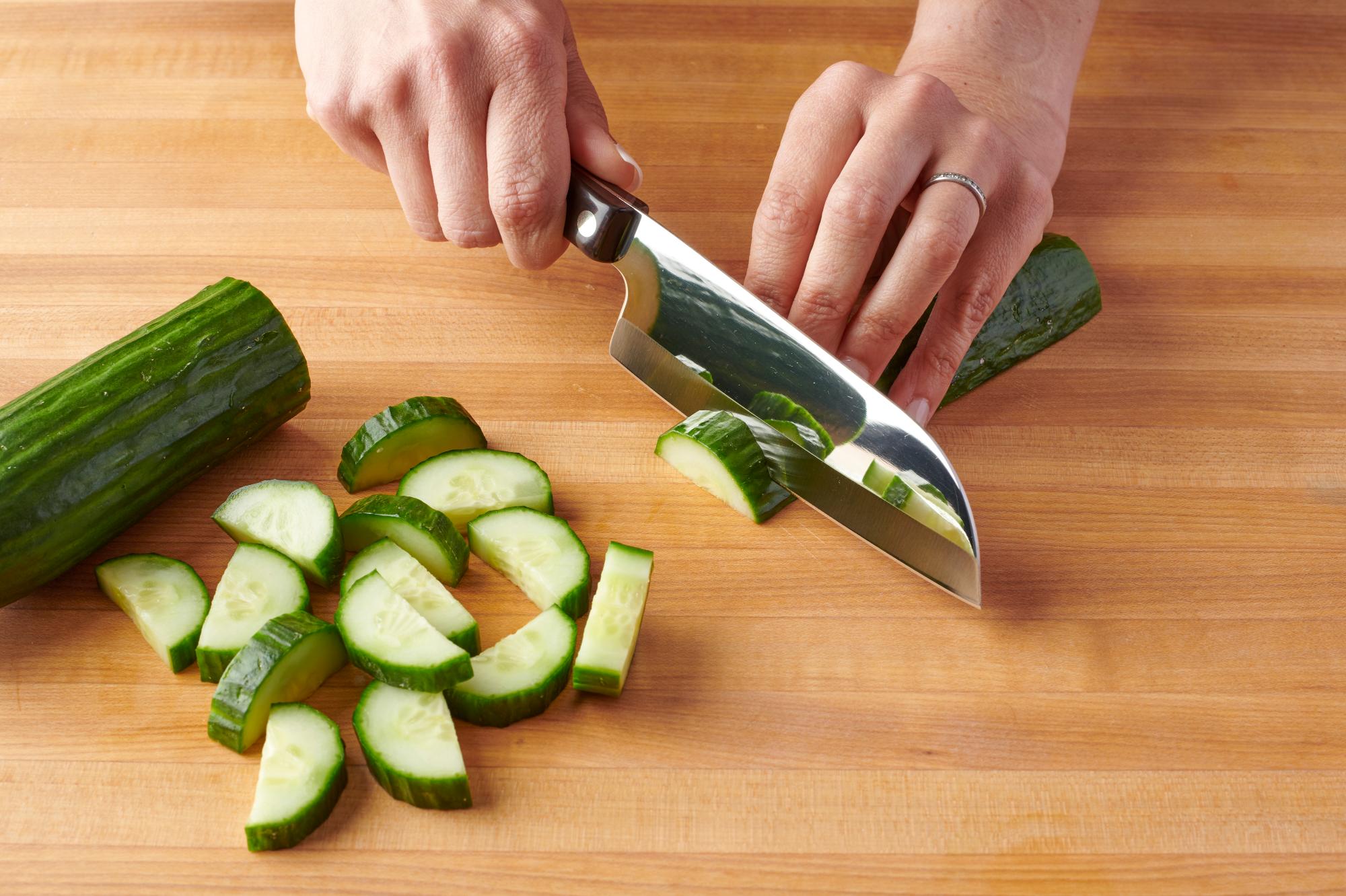 Slicing the cucumber with a Petite Santoku.