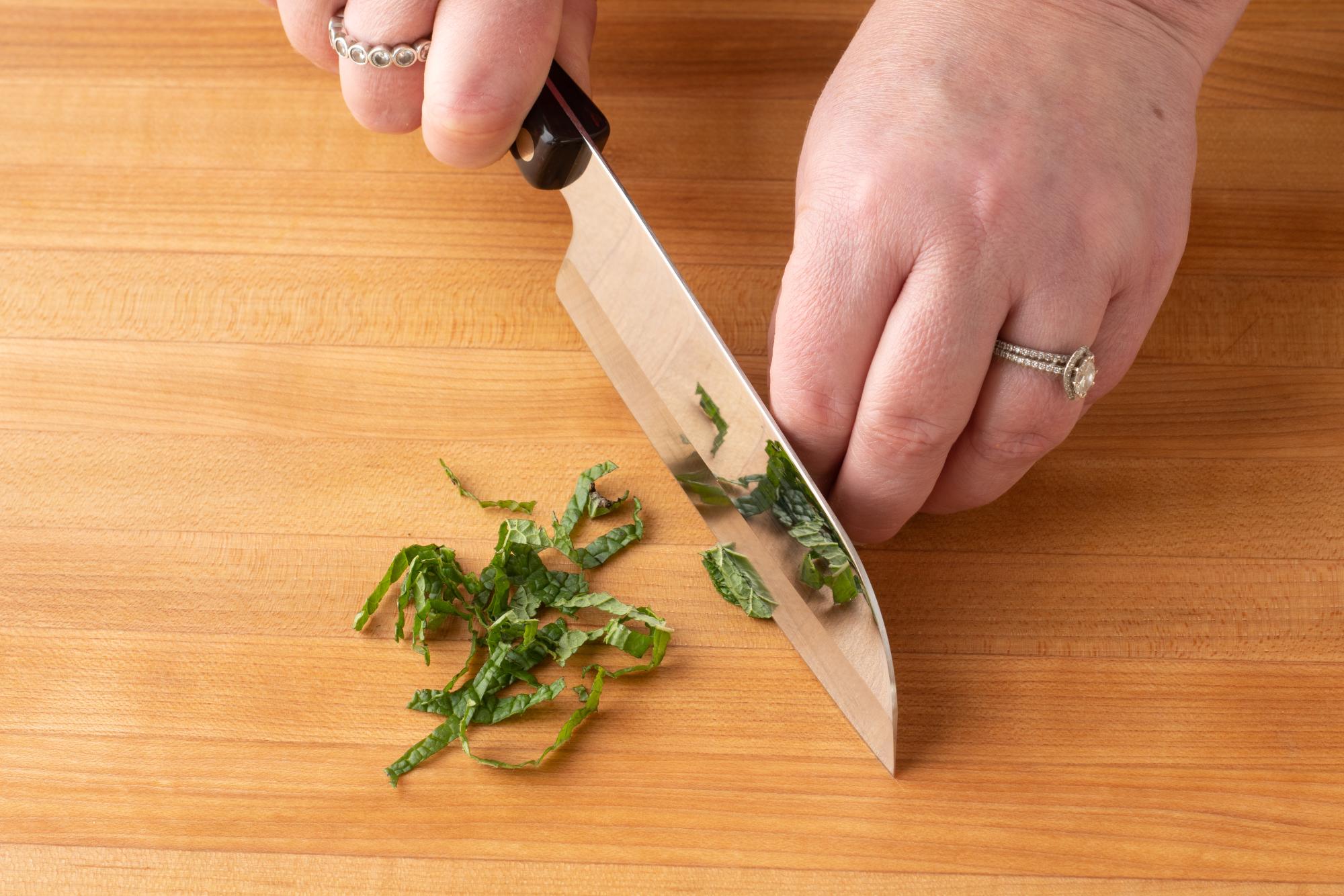 Thinly slice the mint with a Petite Santoku.