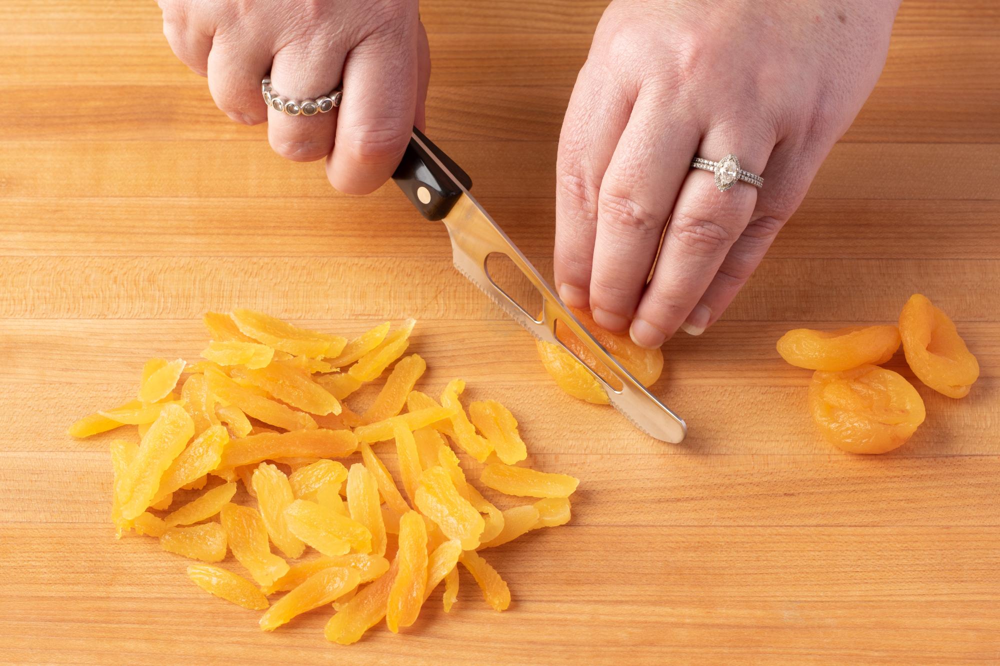 Use a Mini Cheese Knife to slice the dried apricots.