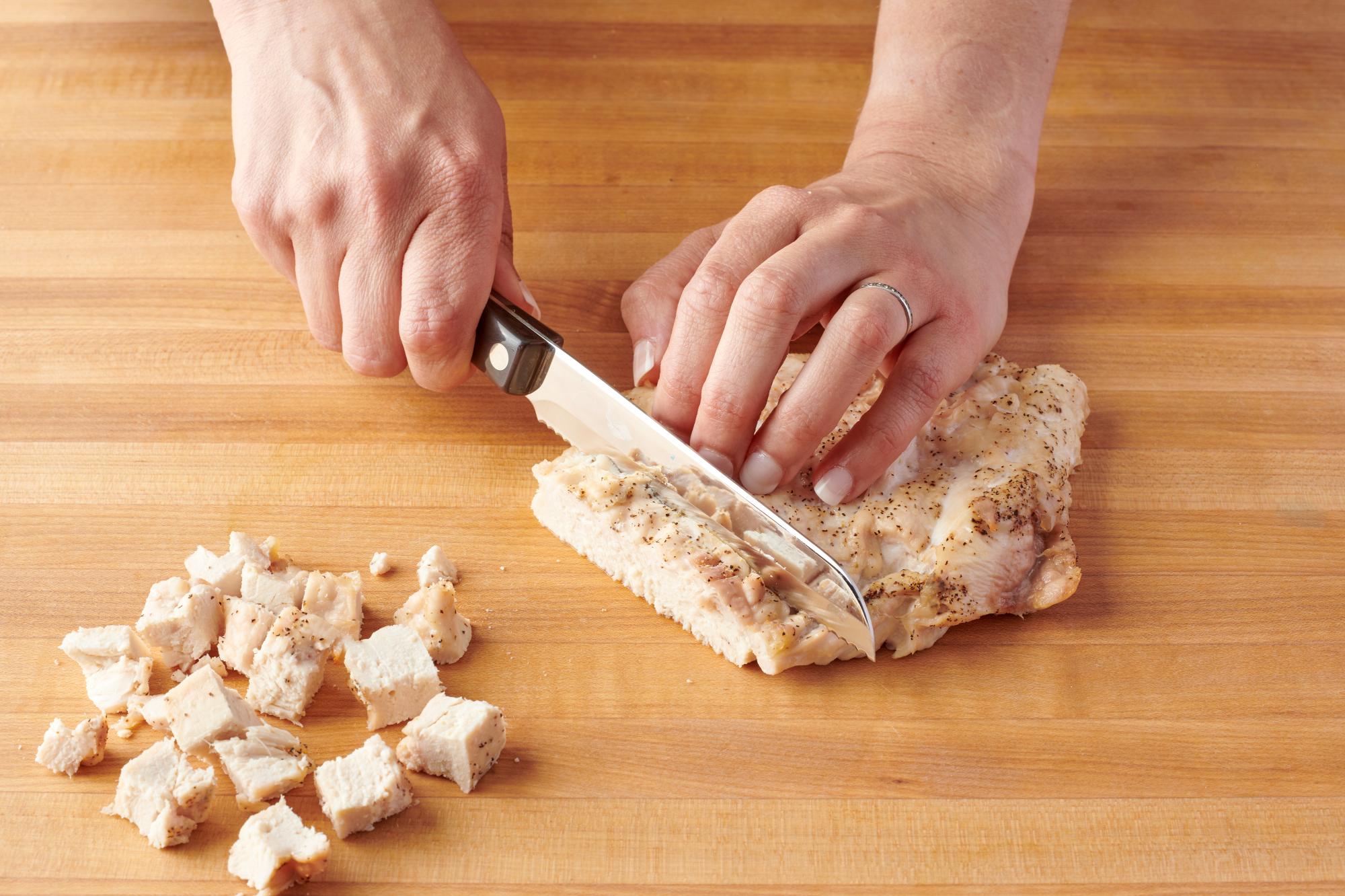 Cutting Chicken with a Santoku Style Trimmer.
