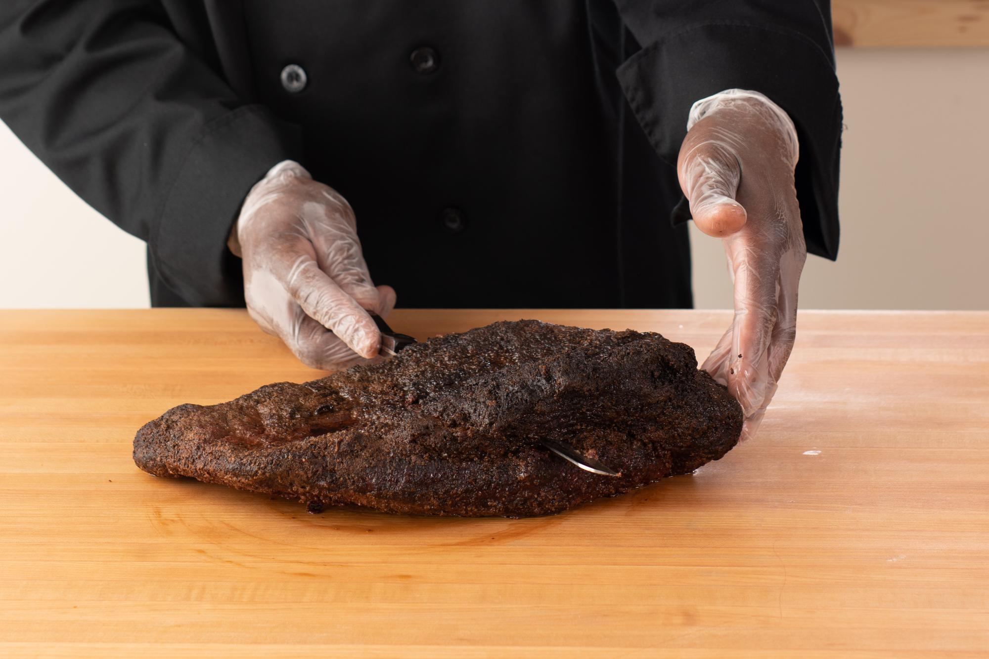 Using a Santoku-Style Slicer to cut the point from the flat.