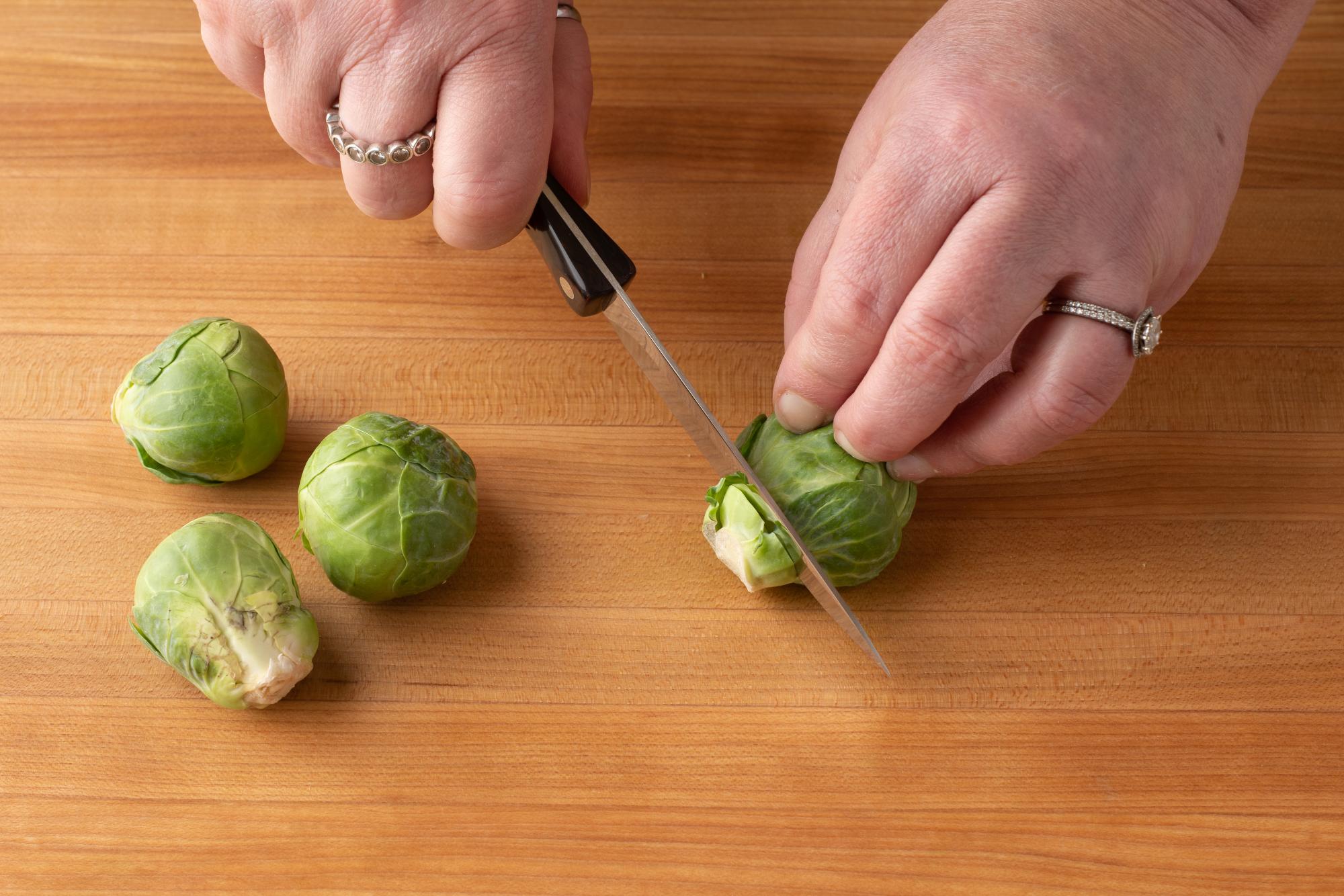 Use the Gourmet Paring Knife to trim the ends off the Brussel sprouts.