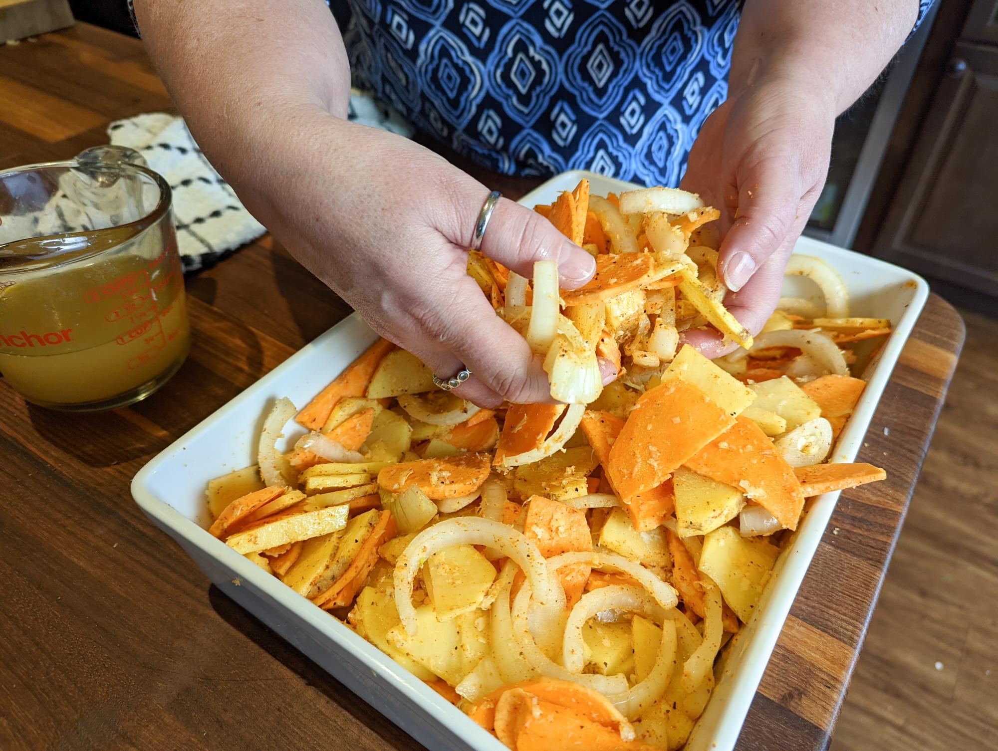 Mixing the onions and potato.