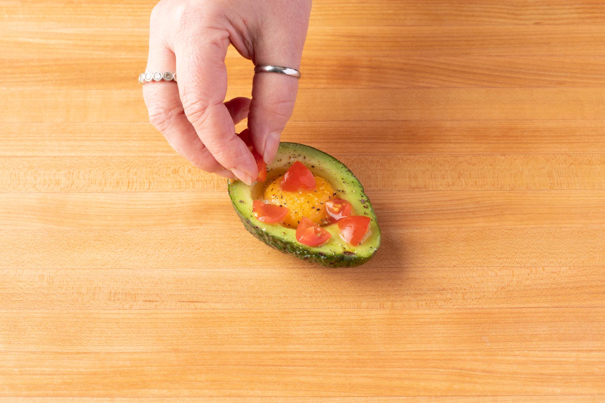 Top the avocado with whatever you'd like.