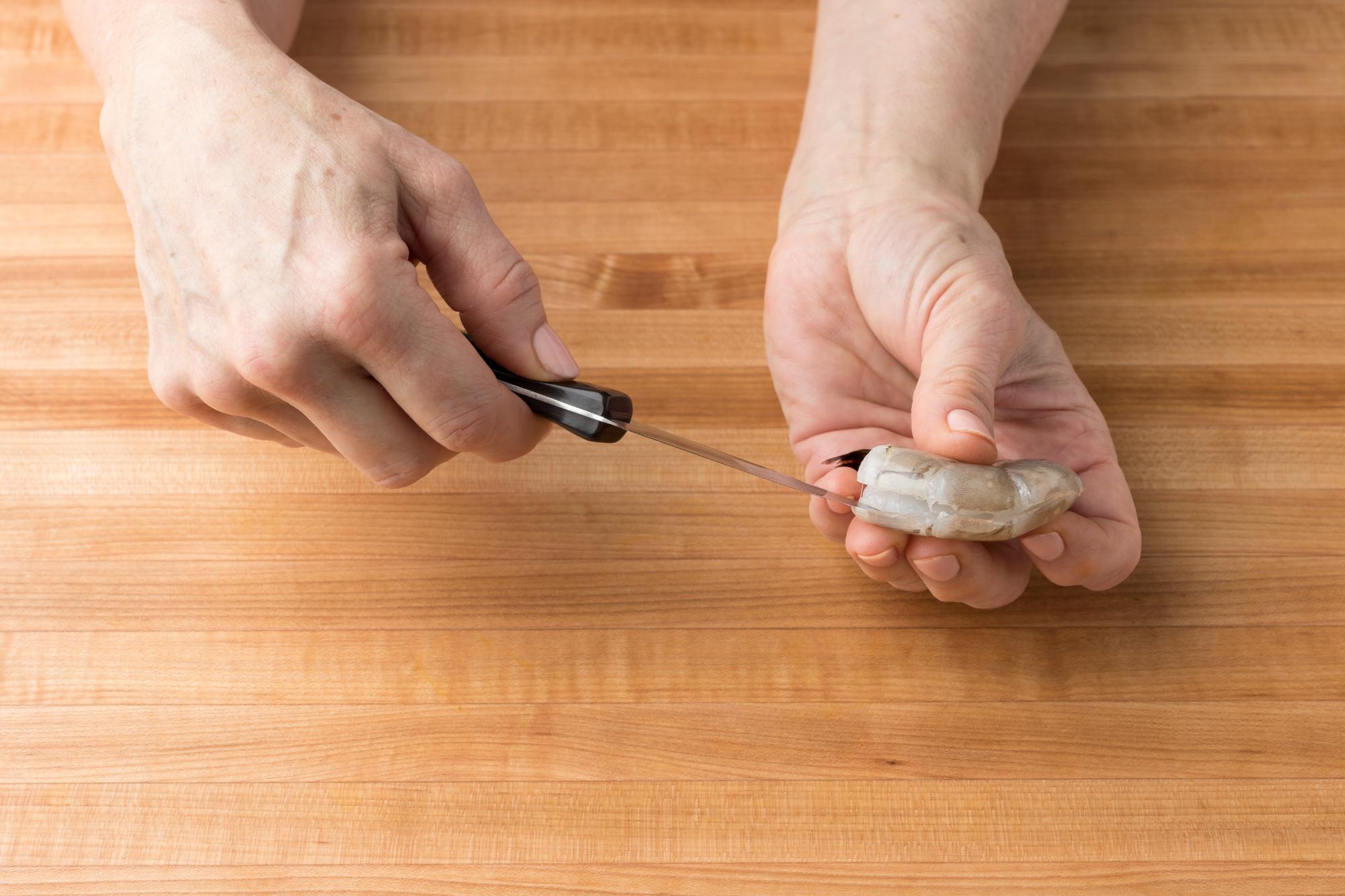 Deveining a shrimp with a Paring Knife.