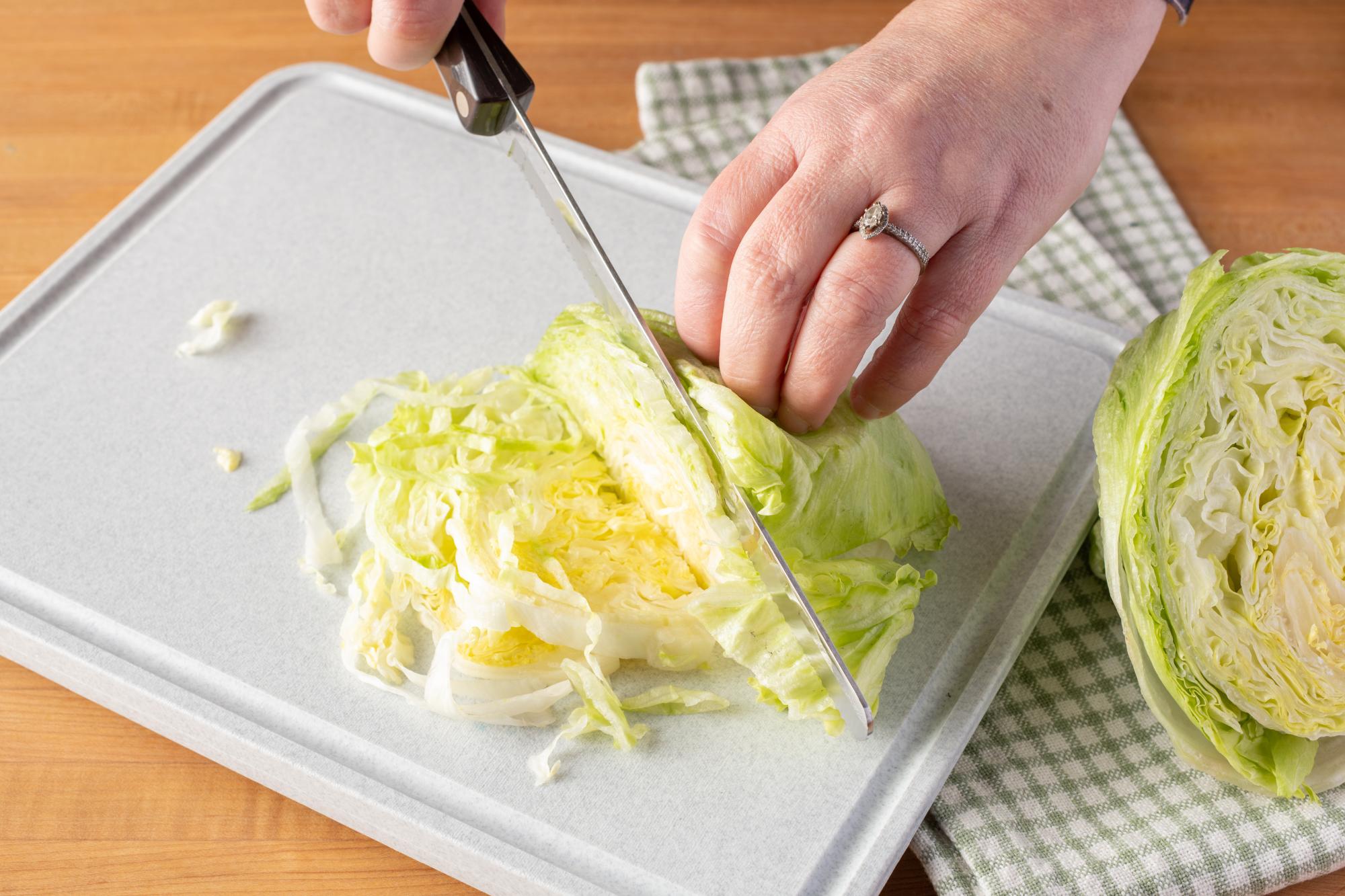 Using a Petite Slicer to shred the lettuce.