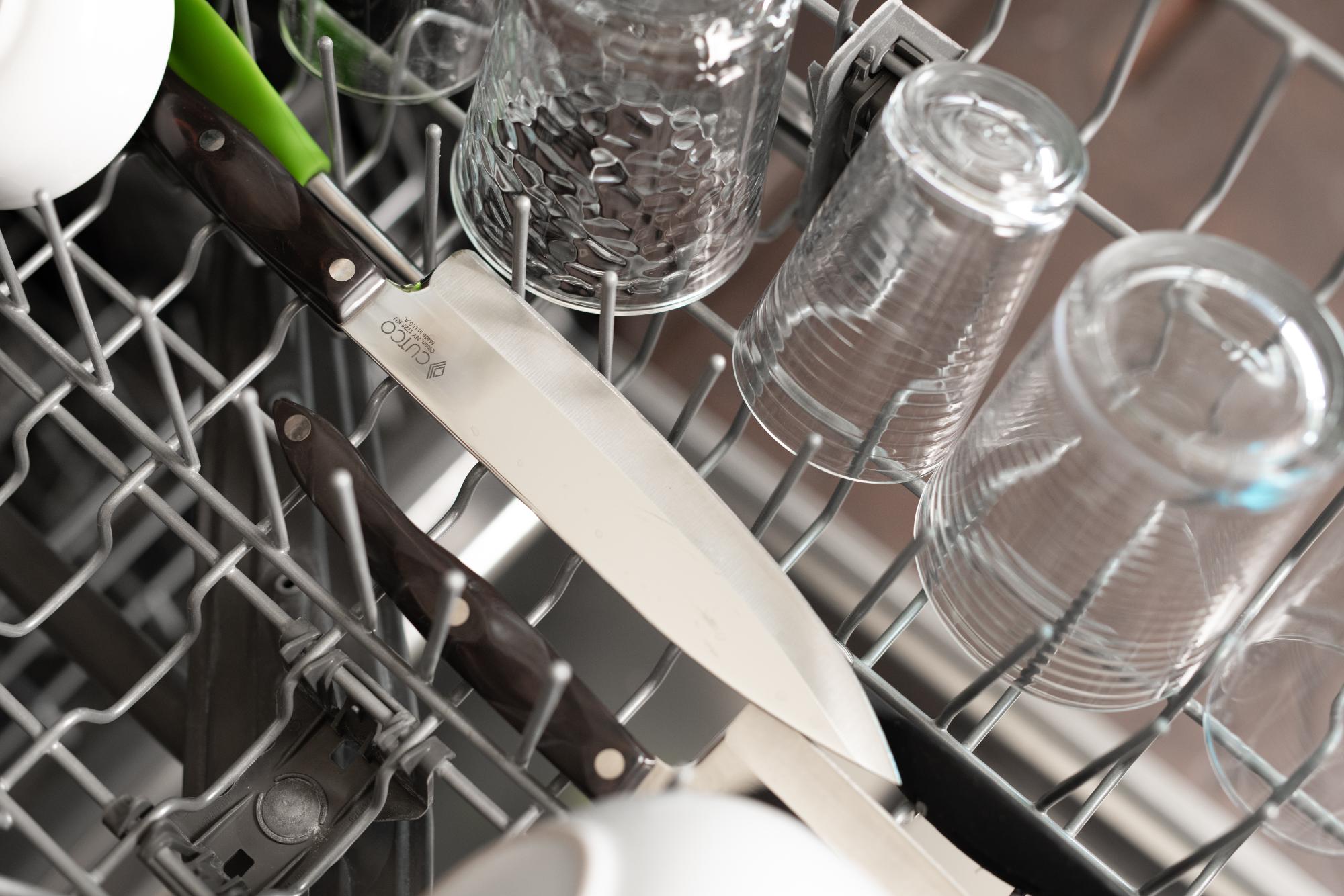 Knife improperly loaded into a dishwasher.