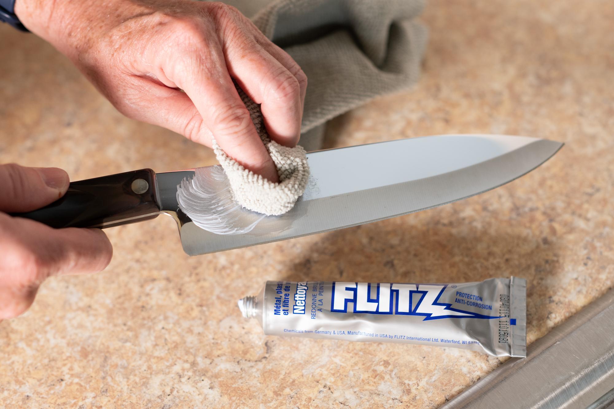 Using Flitz polisher on the blade.