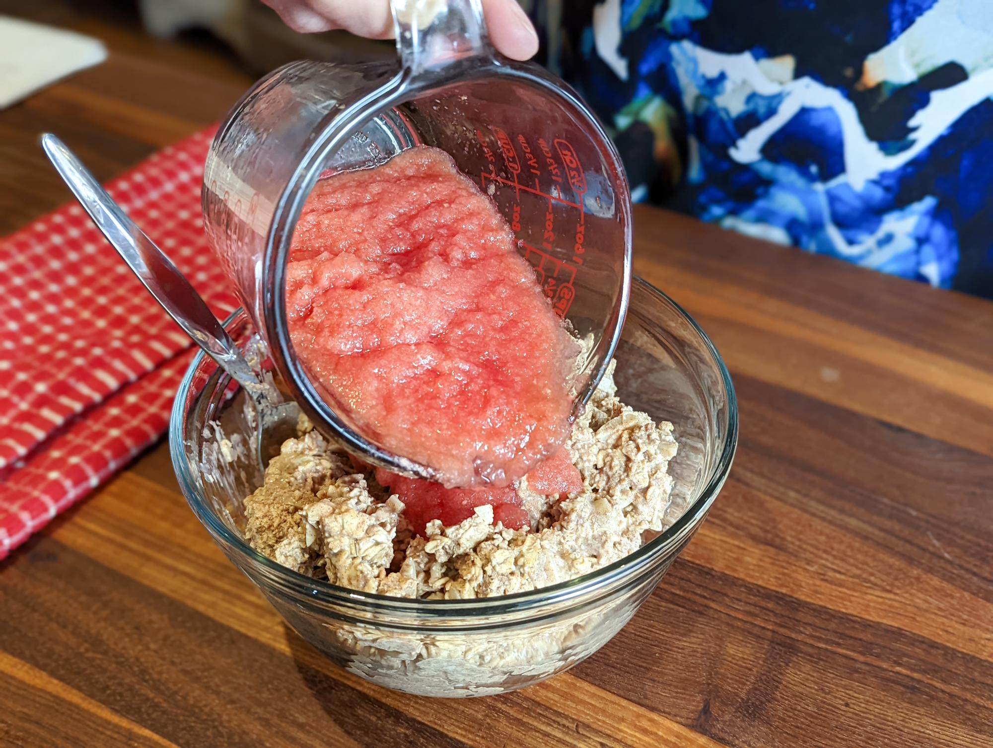 Adding the watermelon puree to the oats