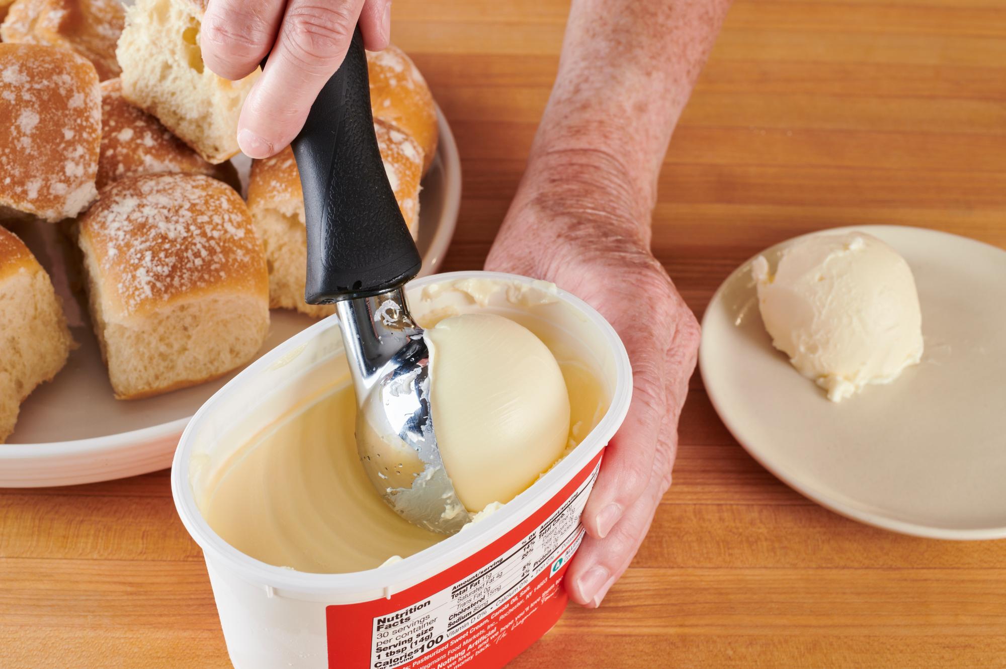 Scooping a butter ball with an Ice Cream Scoop.