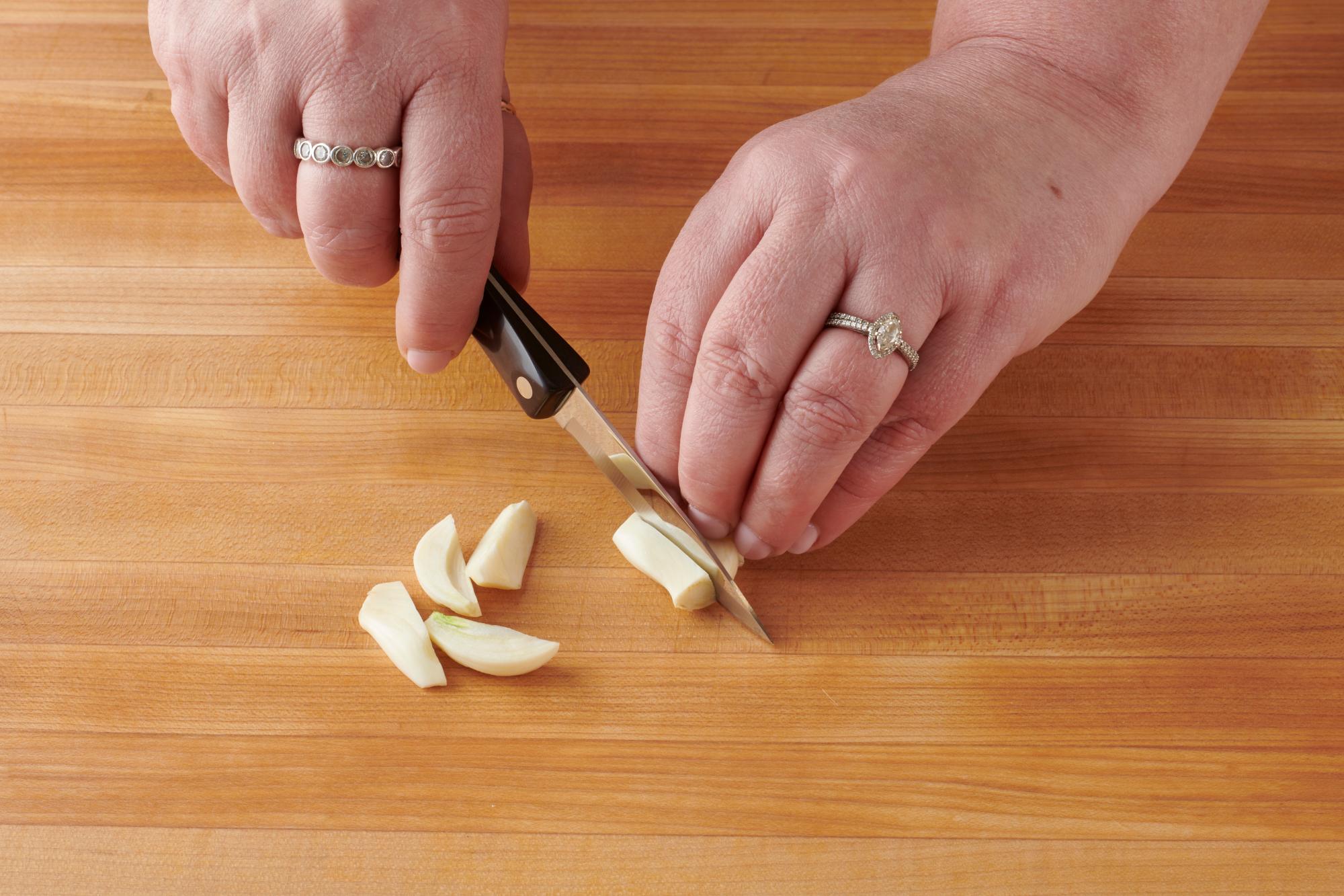 Cutting garlic with a Paring Knife.
