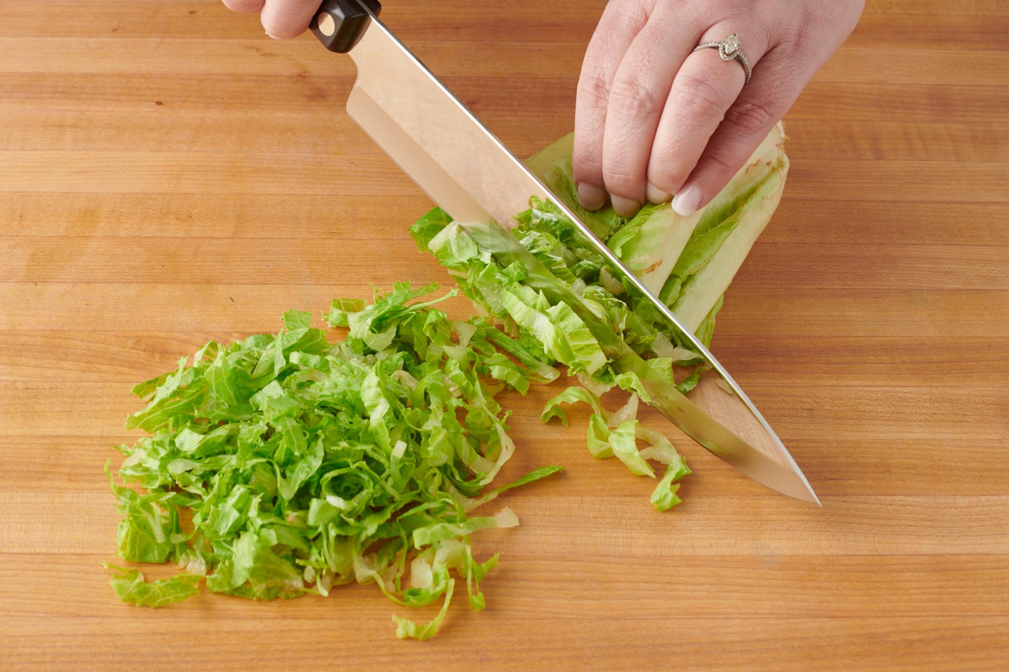 Chopping the romaine lettuce with a French Chef.