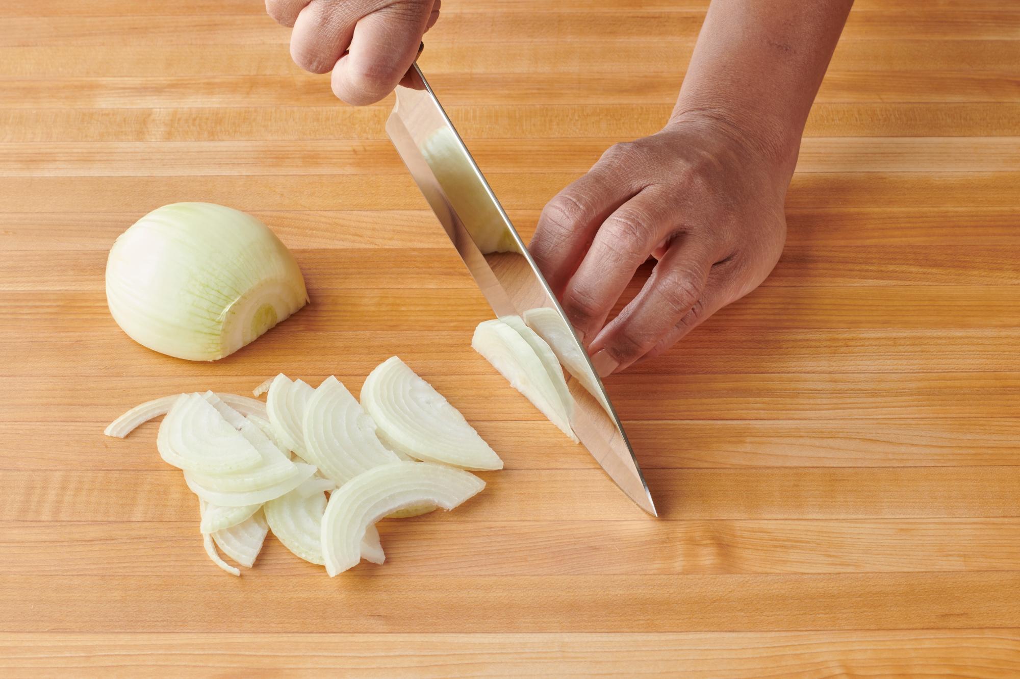 Slicing onions with a Petite Chef.