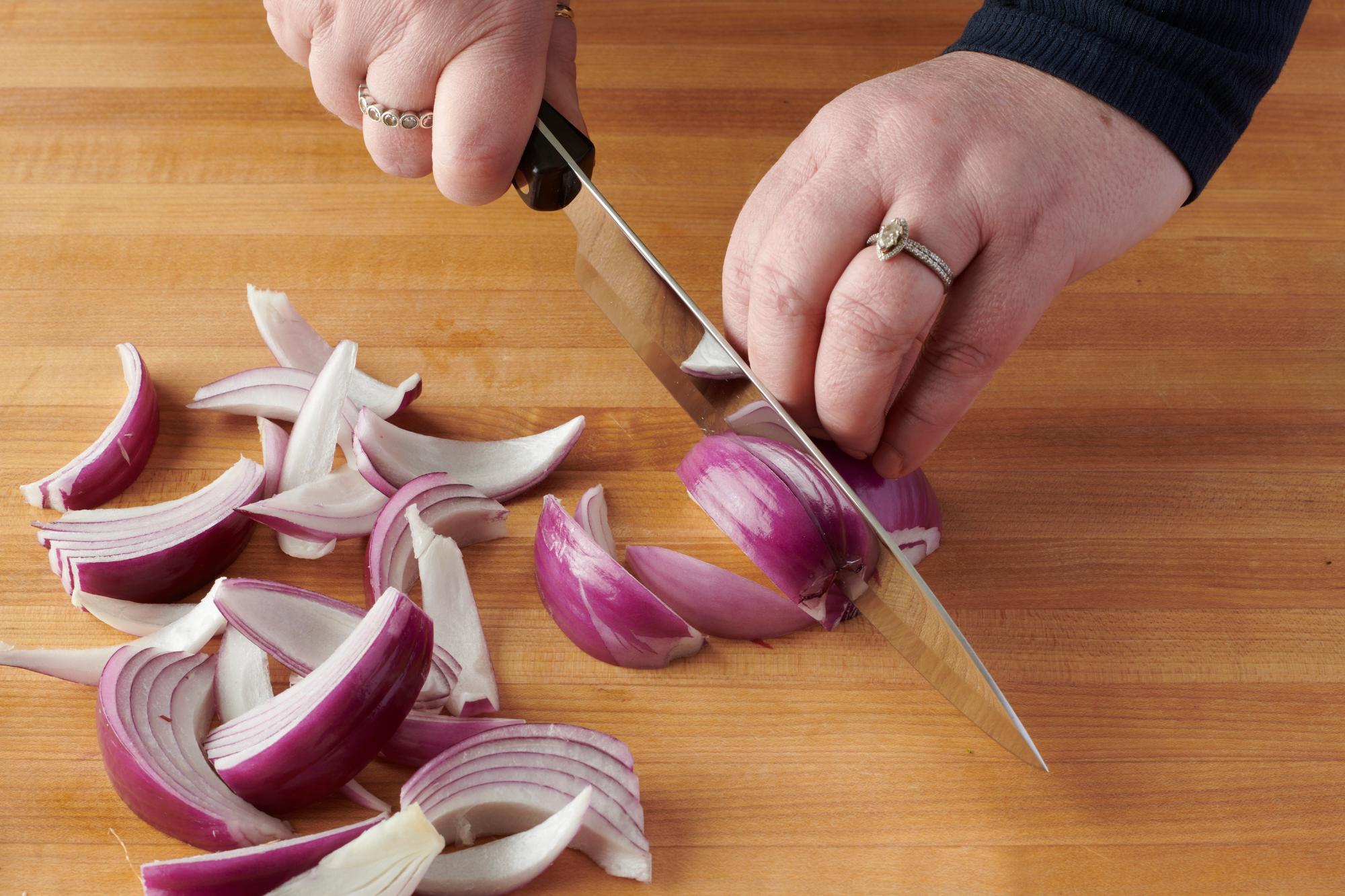 Slicing the red onion with a Petite Chef.