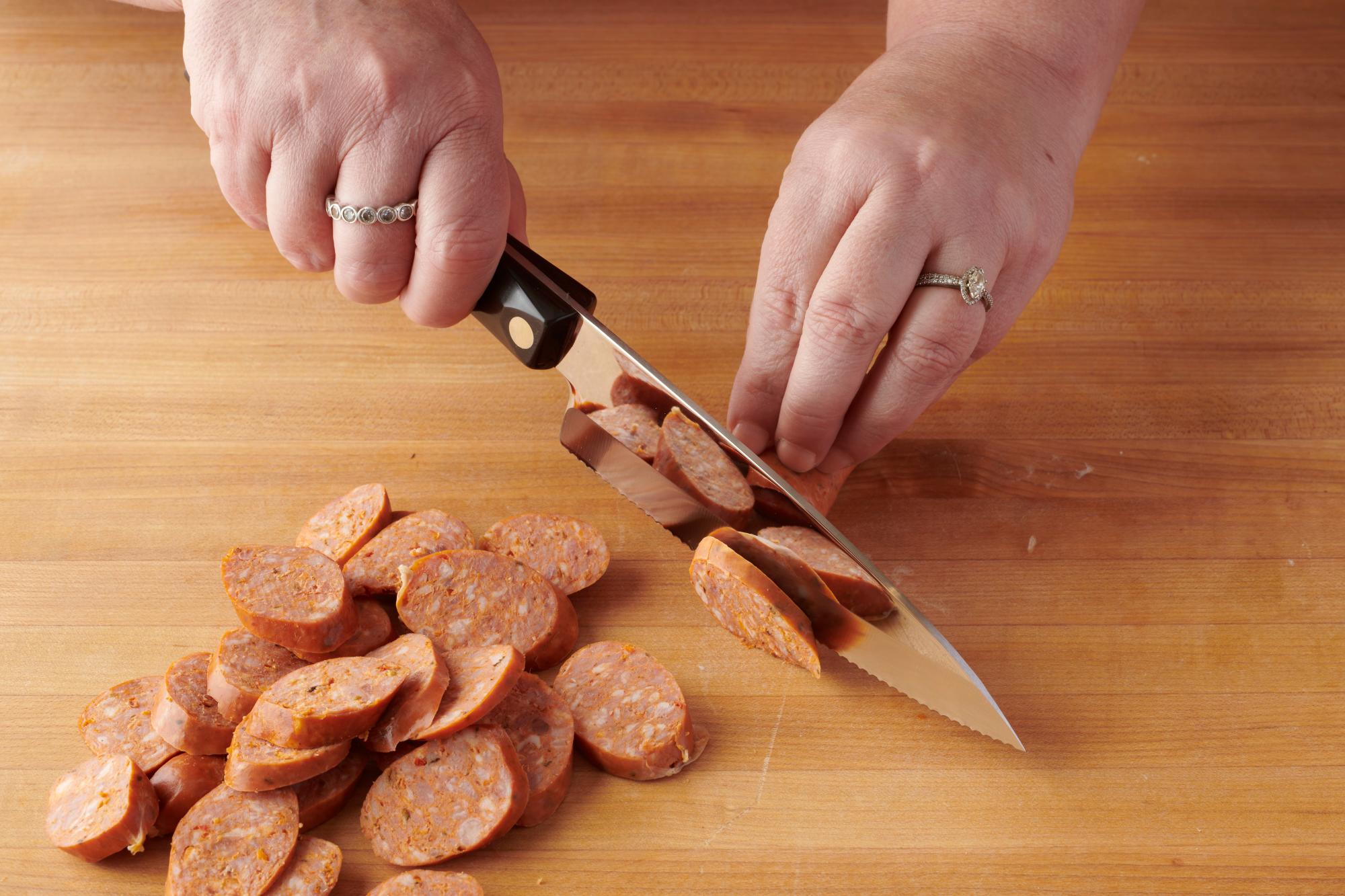 Slicing the chorizo with a Gourmet Prep Knife.