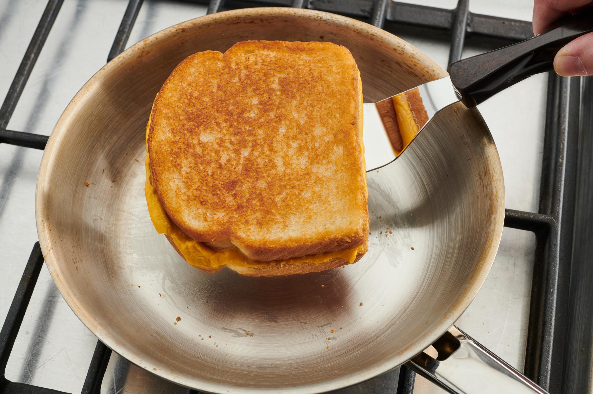 Flipping a grilled cheese with a Turn n' Serve.