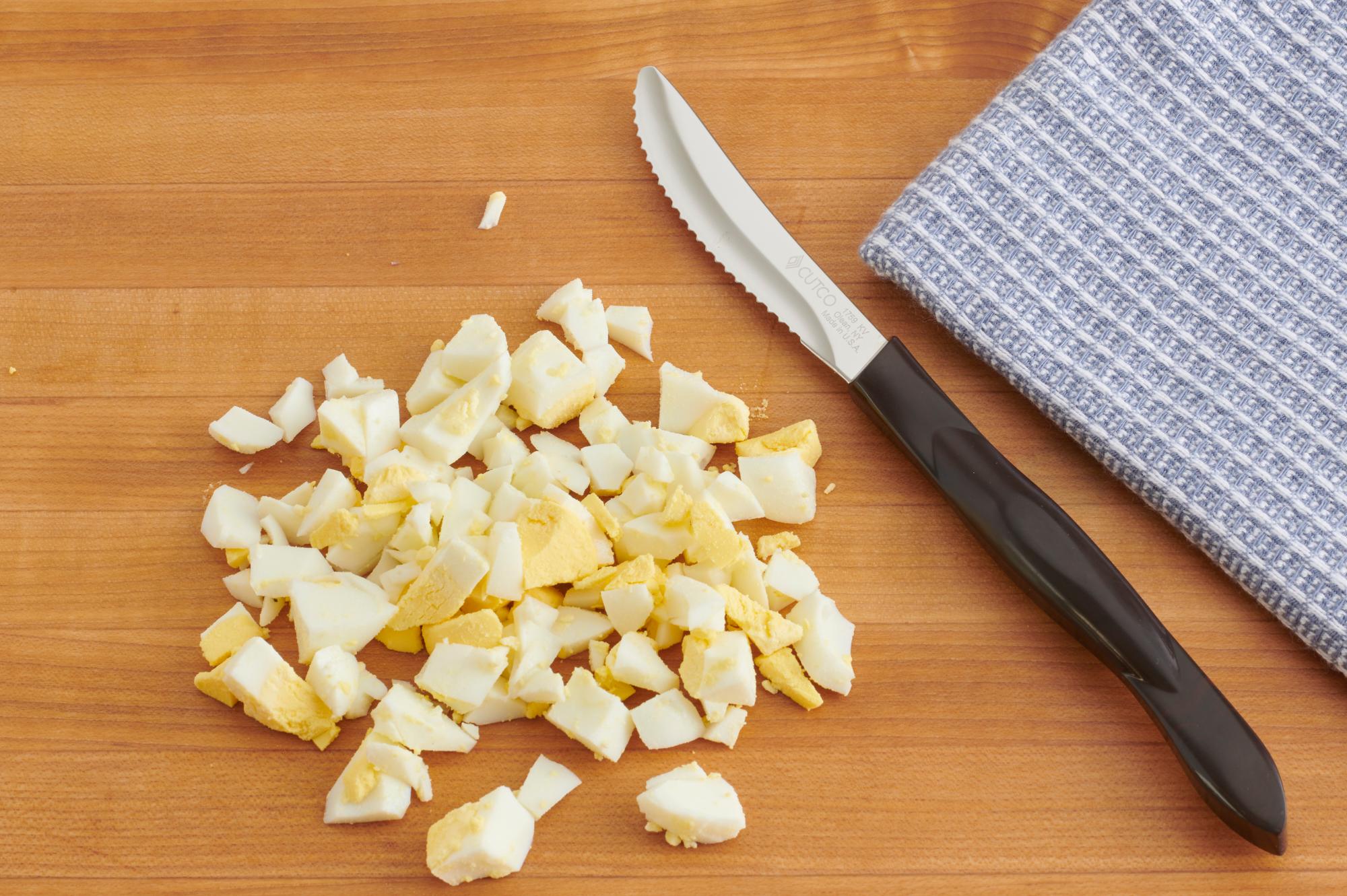 Use a Table Knife to cuts the eggs.