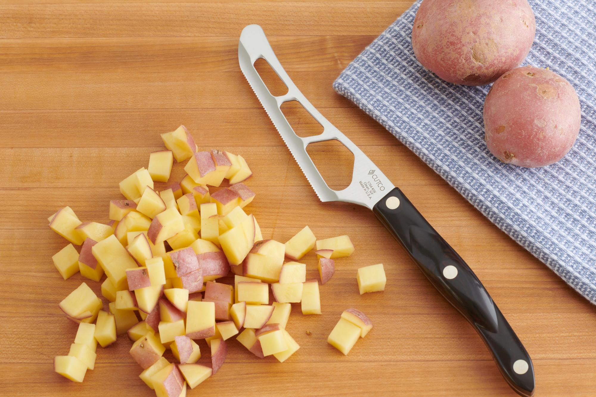 Cutting the potatoes with a Traditional Cheese Knife.