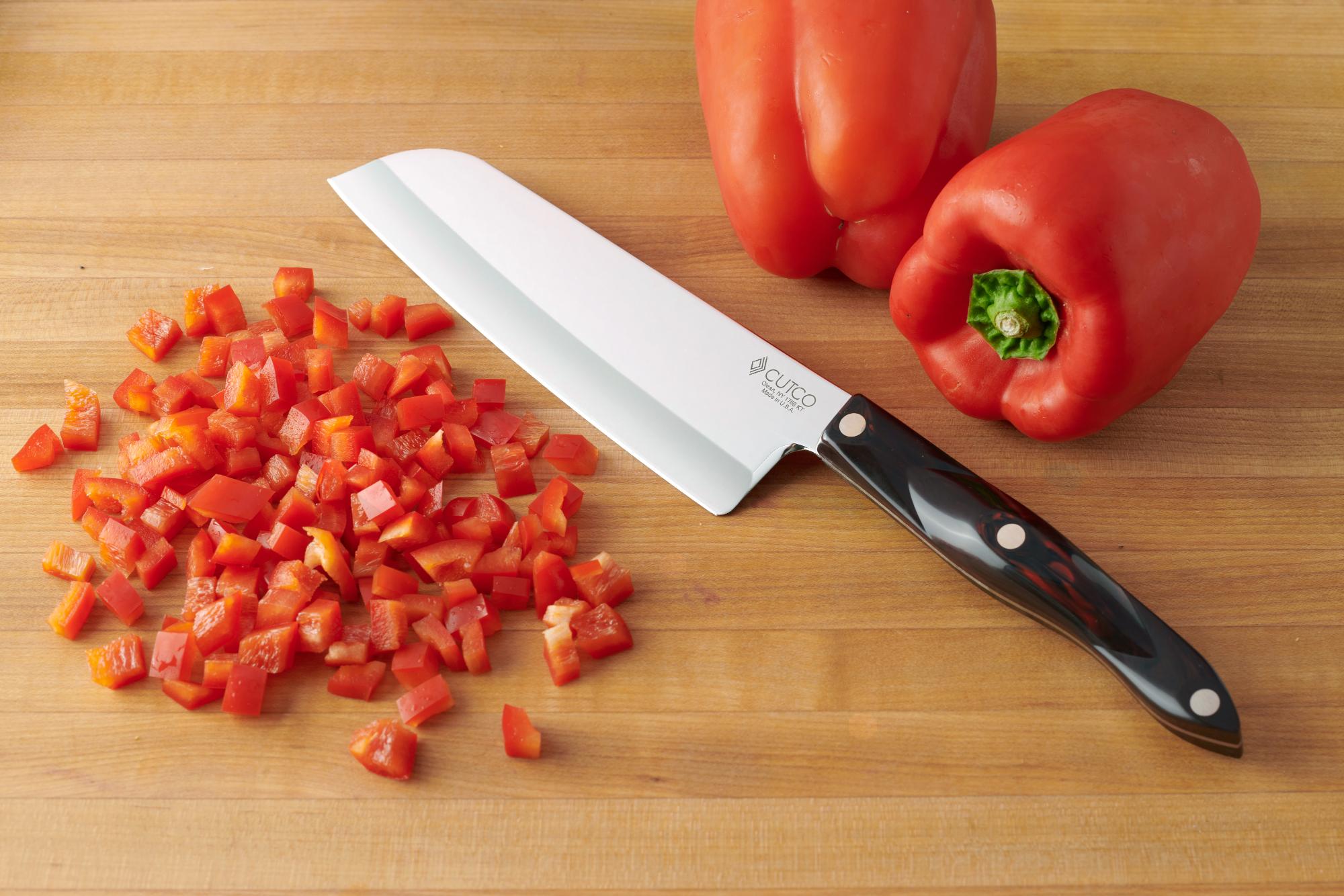 Dicing the red pepper with a Santoku.