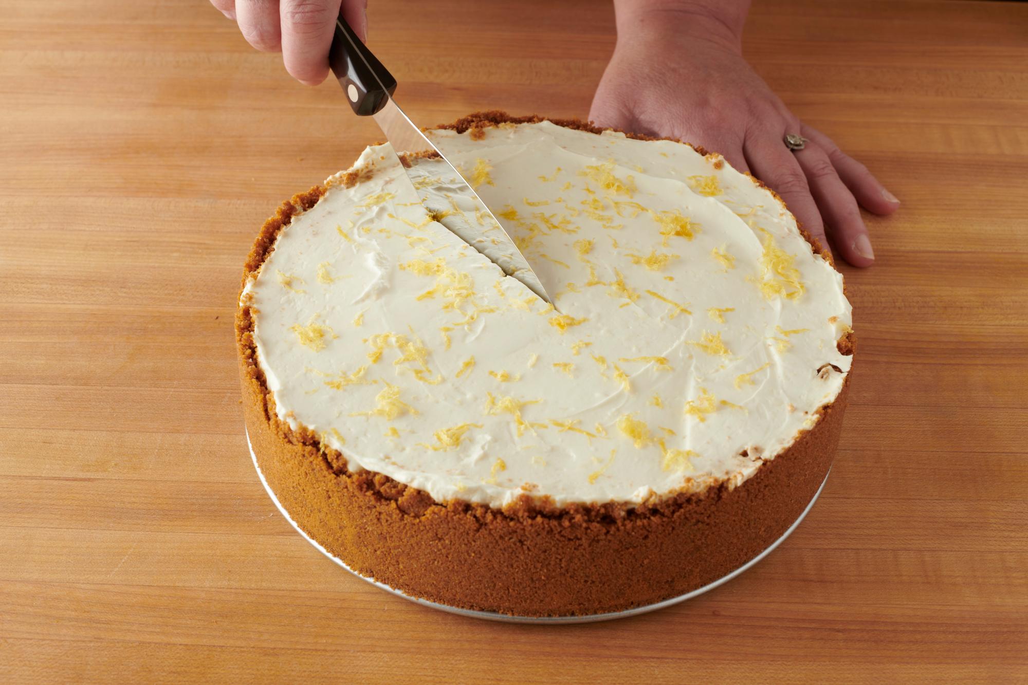 Slicing the cheesecake with a Spatula Spreader.