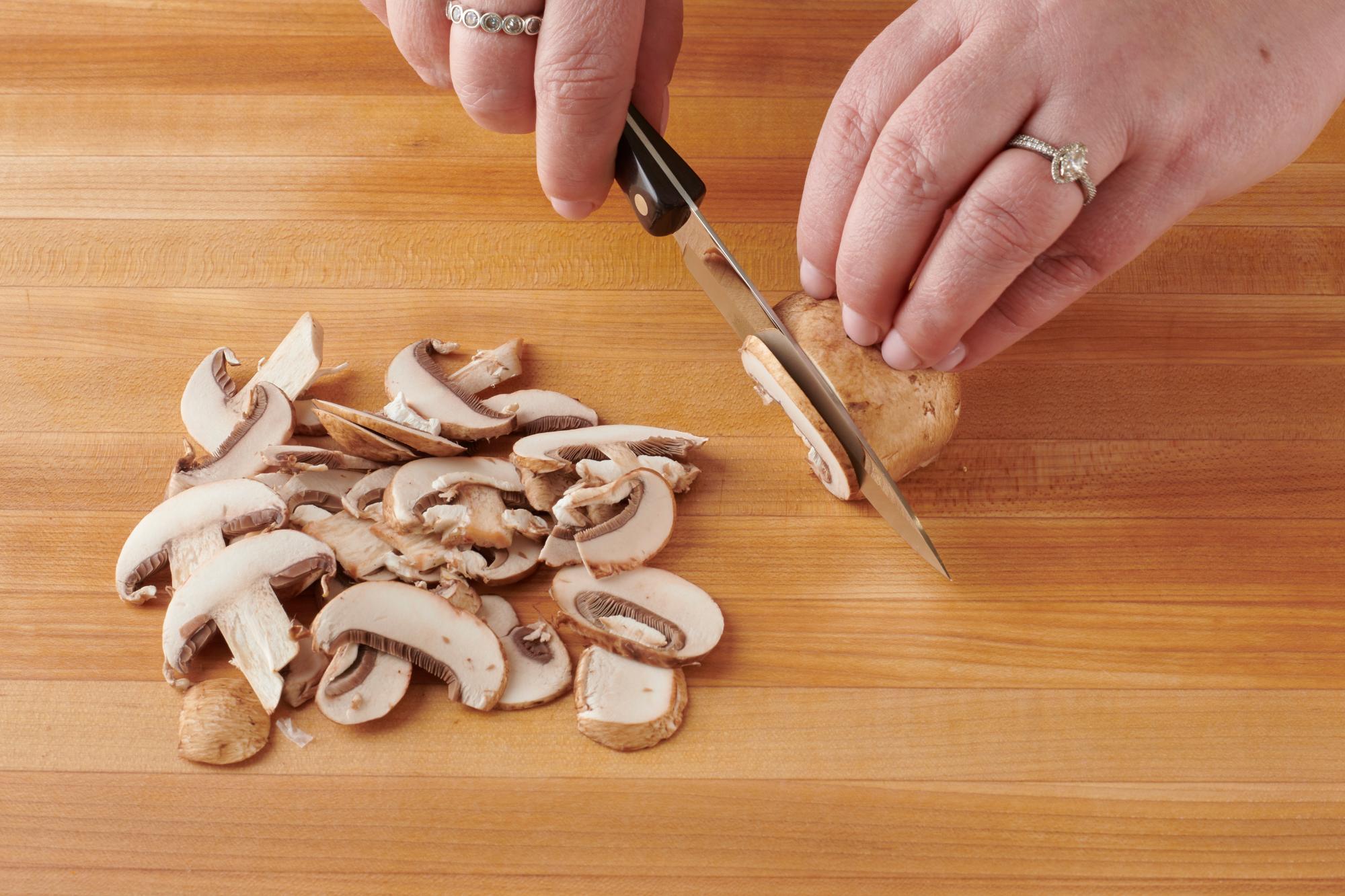 Slicing mushrooms with a 4 Inch Paring Knife.