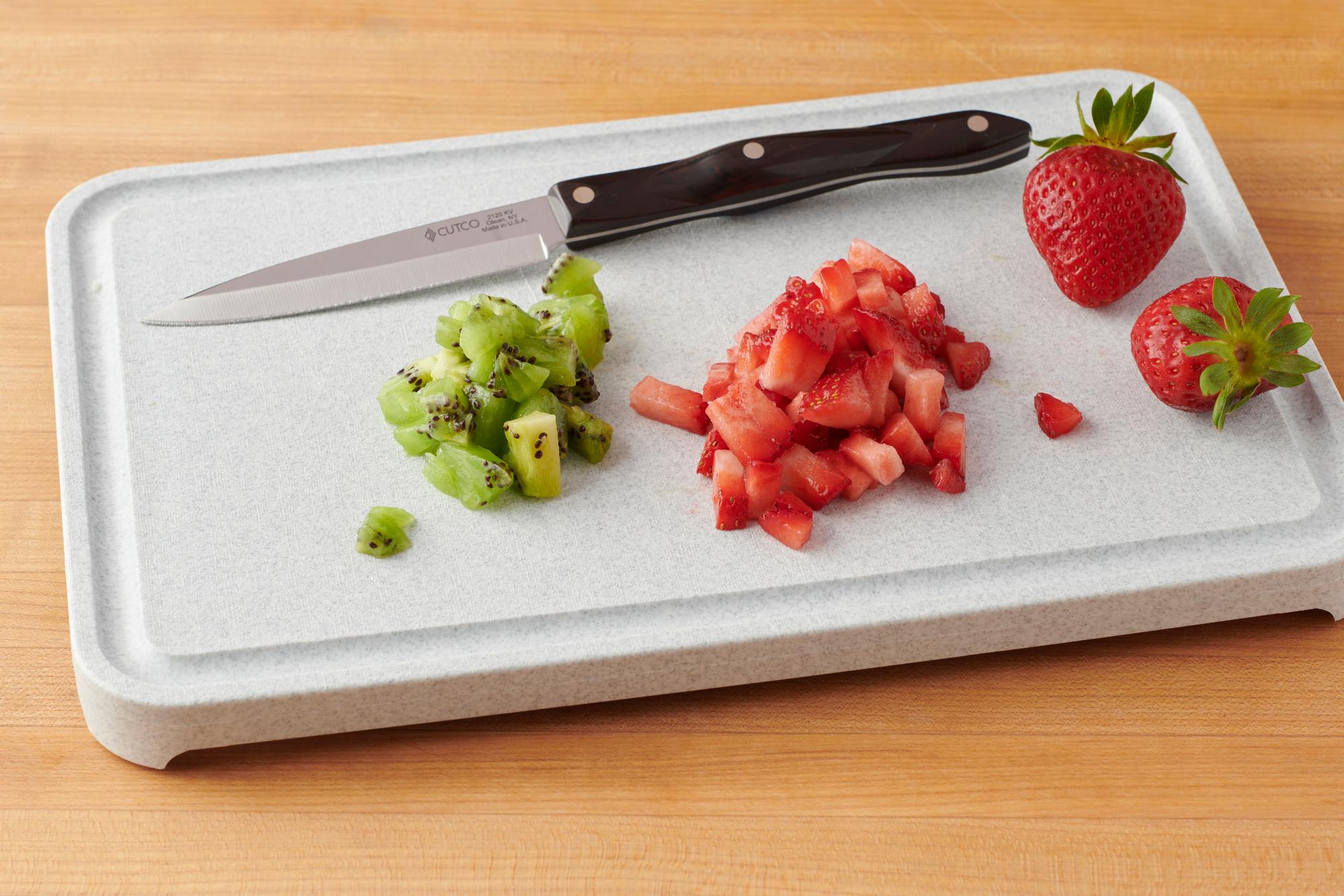 This travel cutting board with a built-in knife cuts out the