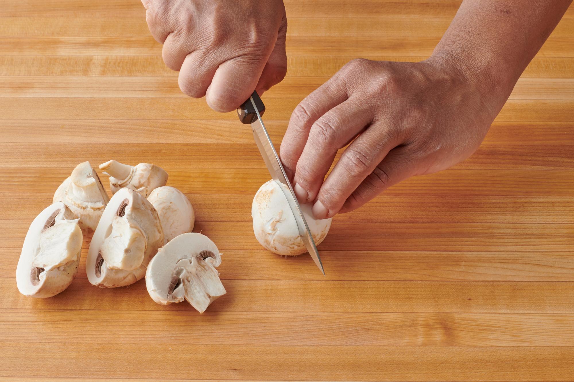 Slicing mushrooms with a 4 Inch Paring Knife.