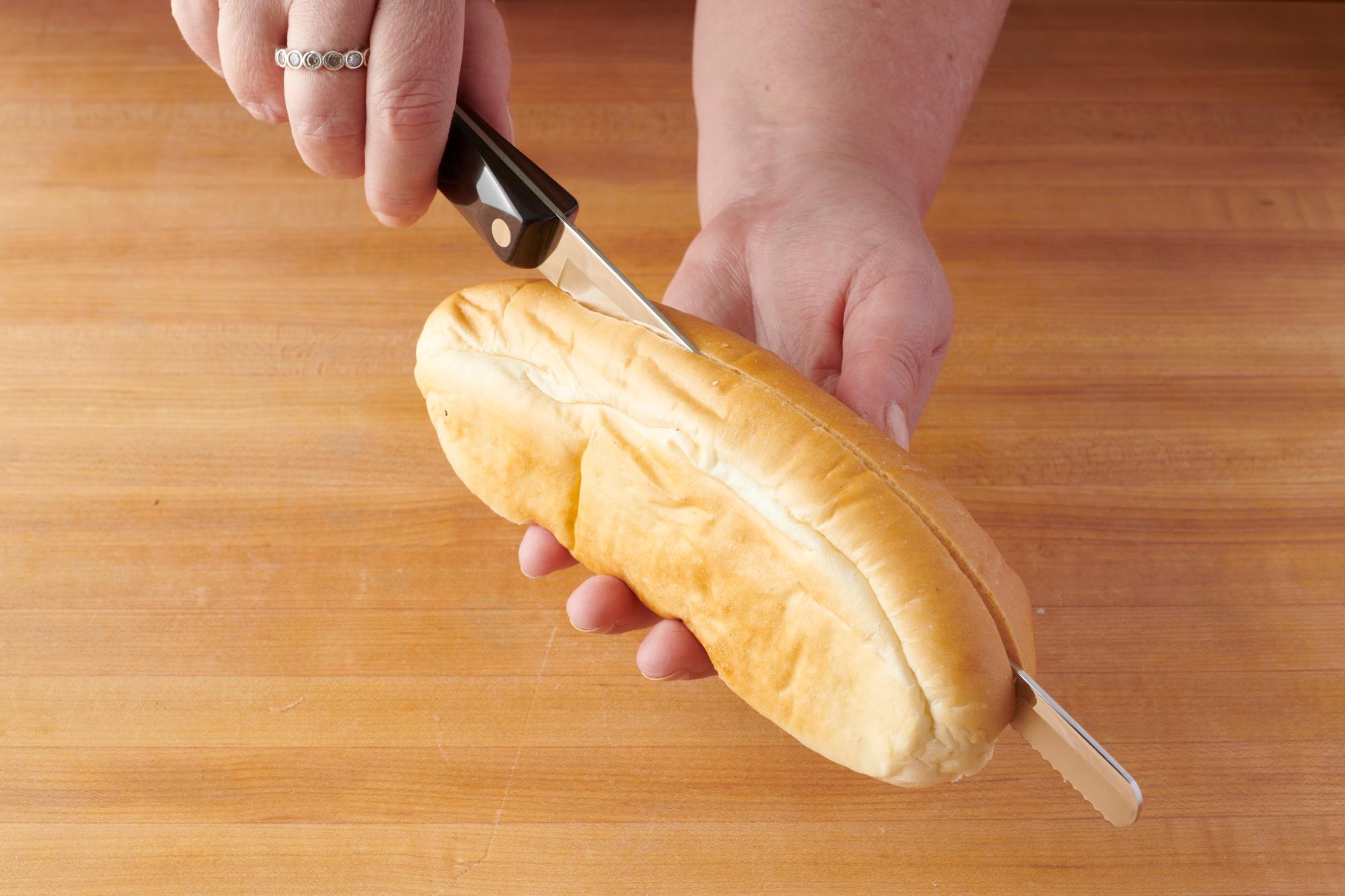 Slicing the sub rolls with a Petite Slicer.