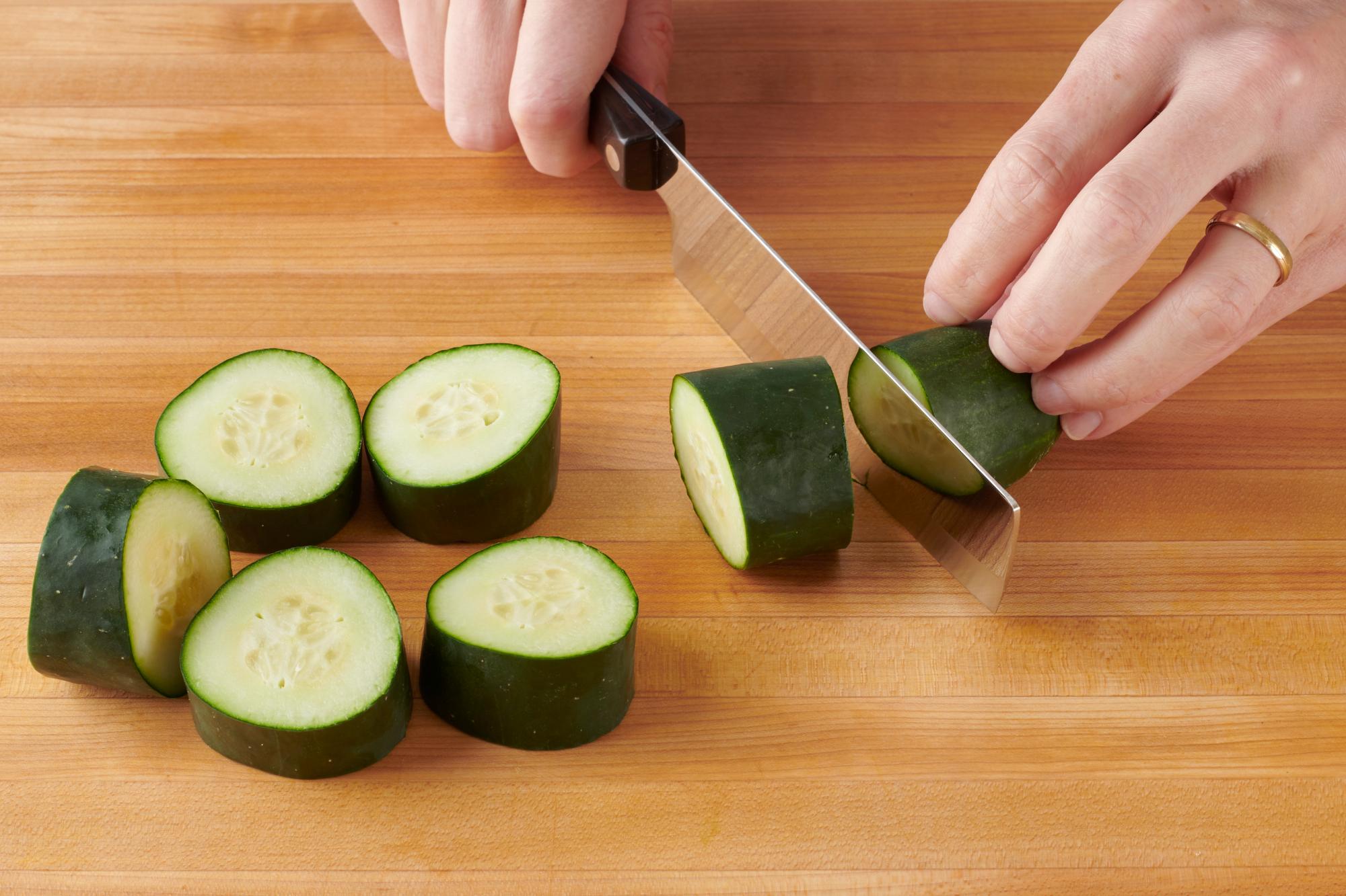 Cutting cucumbers with a 6 Inch Vegetable Knife.