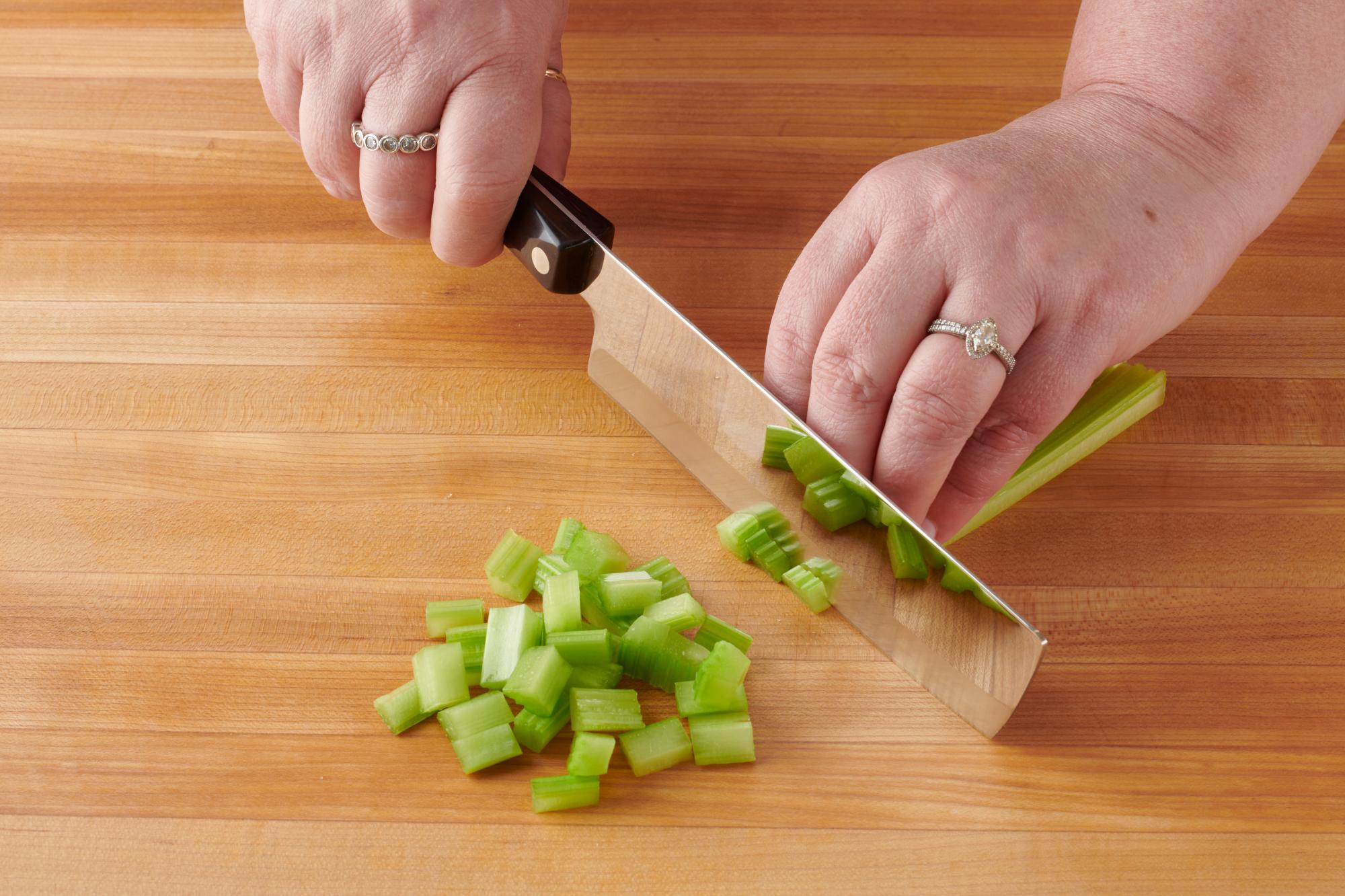 Chop the celery with a 6 Inch Vegetable Knife.