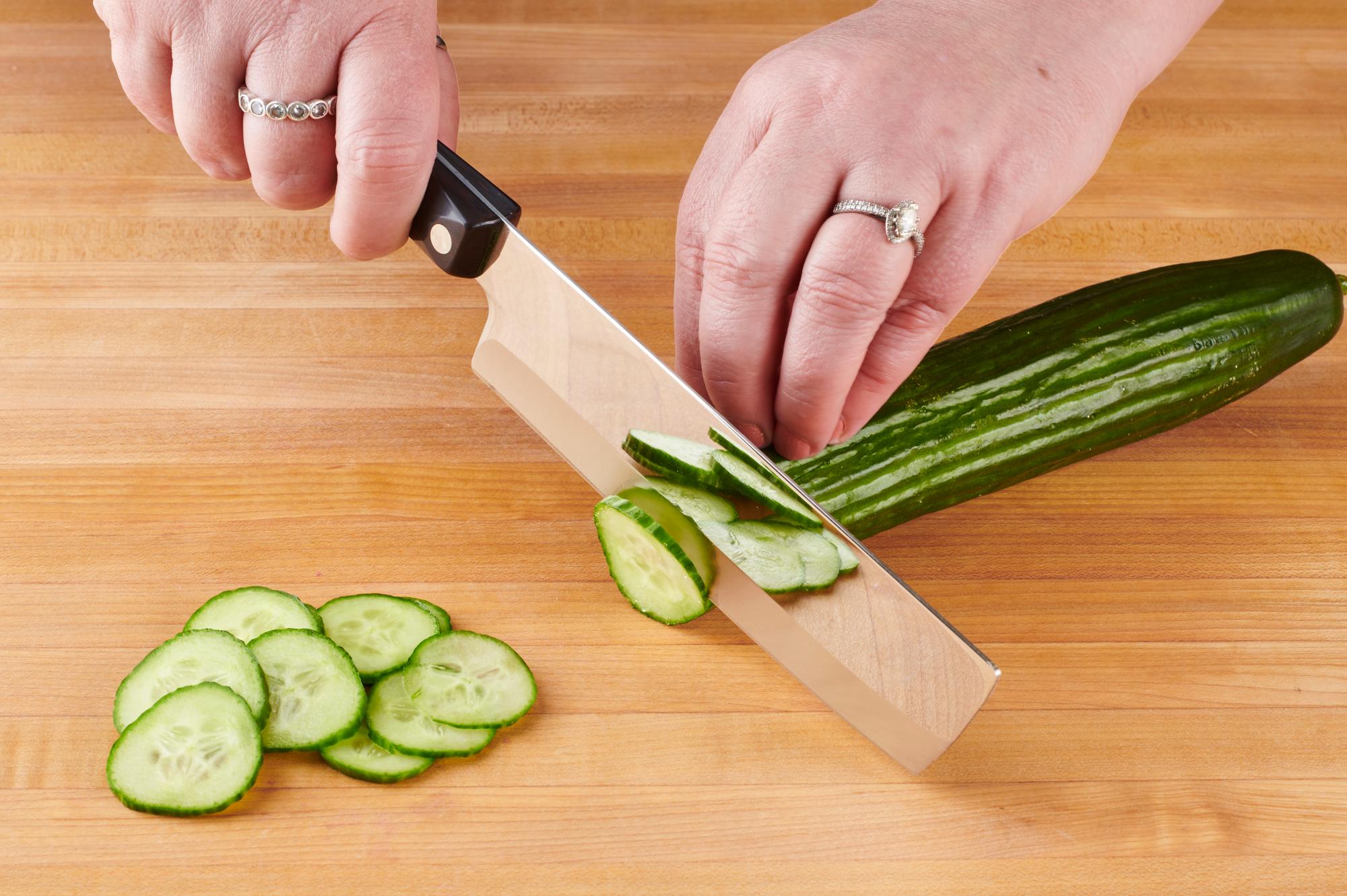 Slicing Cucumber with a 6 Inch Vegetable Knife.