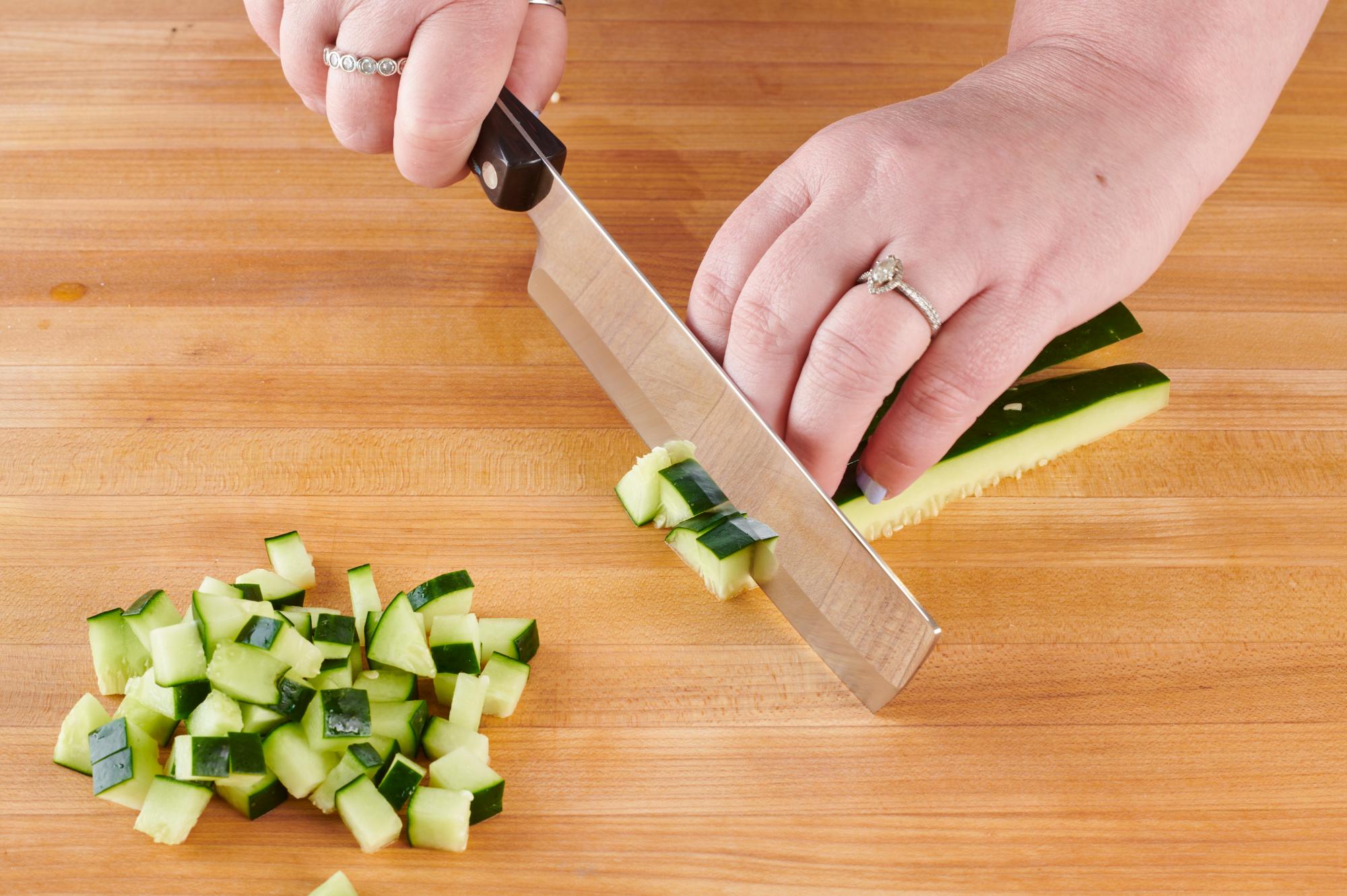 Dicing cucumber with a 6 Inch Vegetable Knife.