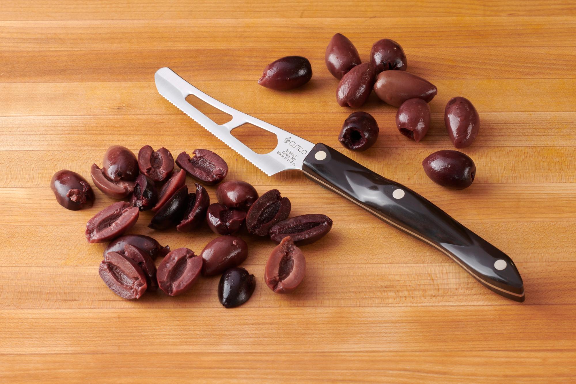 Cutting kalamata olives with a Mini Cheese Knife.