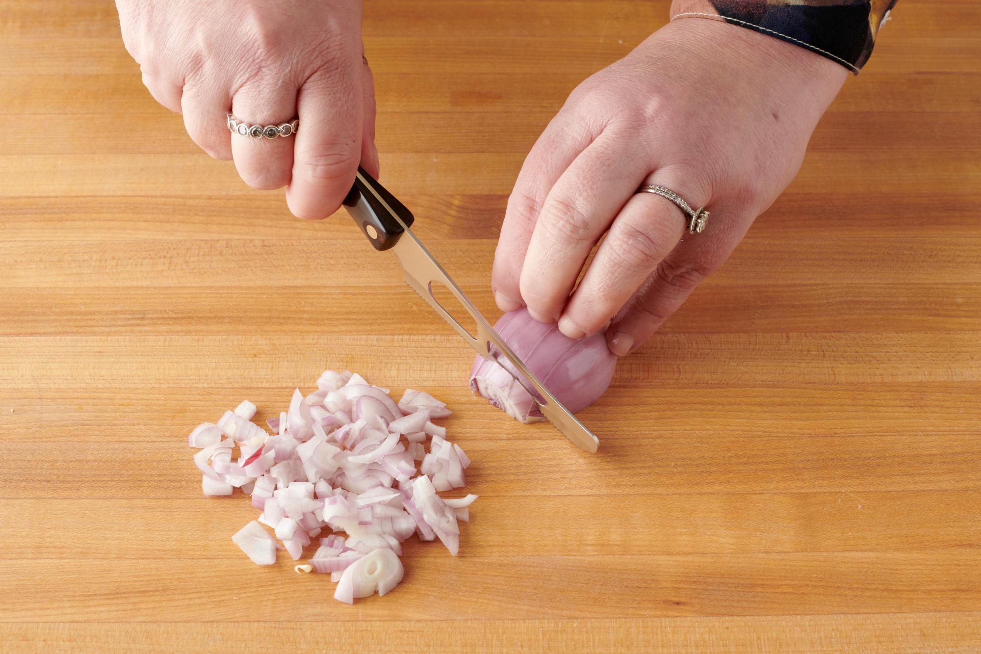 Using the Mini Cheese Knife to chop shallots.