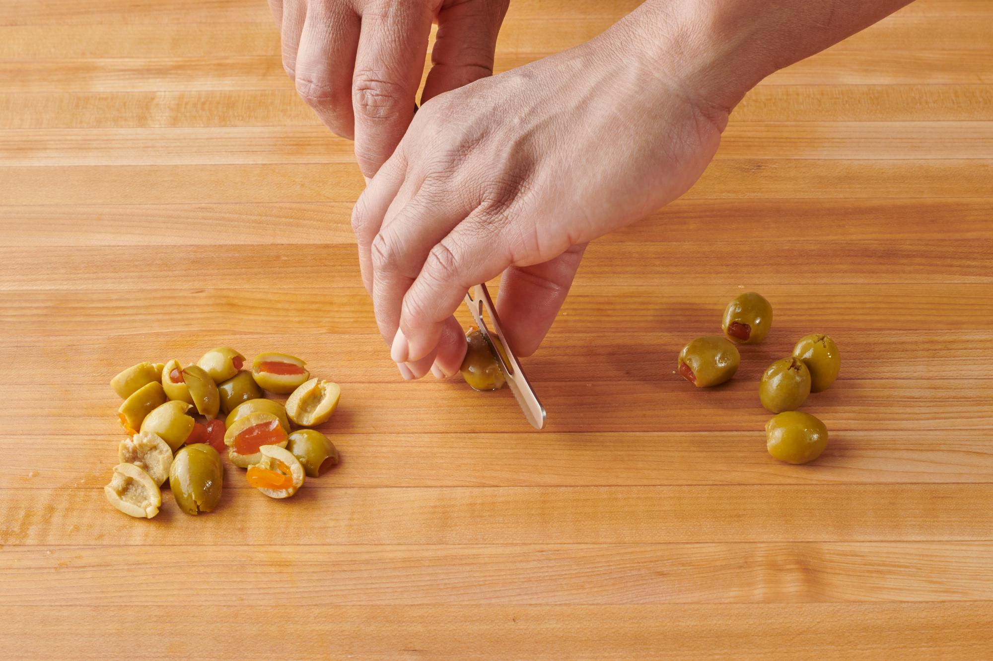 Cutting the Olives with a Mini Cheese Knife.