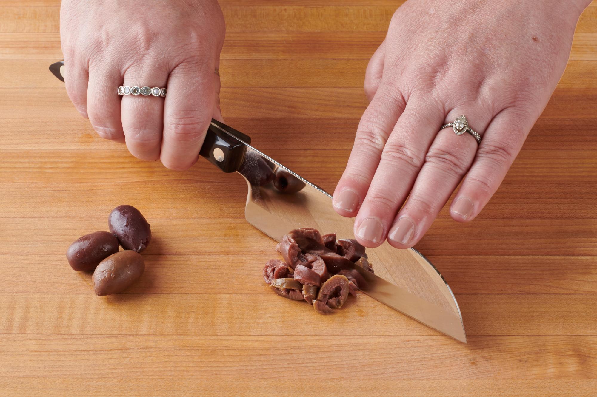 Mincing the olives with a Petite Santoku.