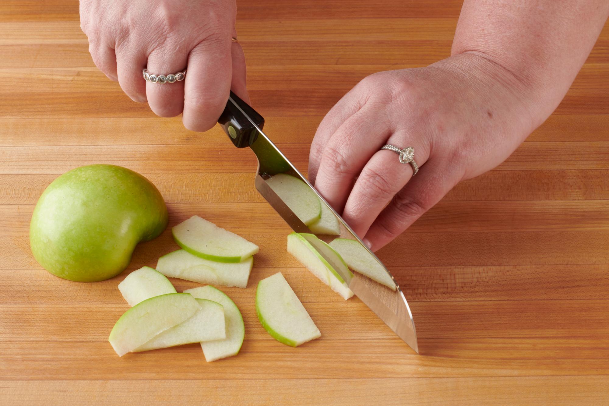 Slicing apples with a Petite Santoku.