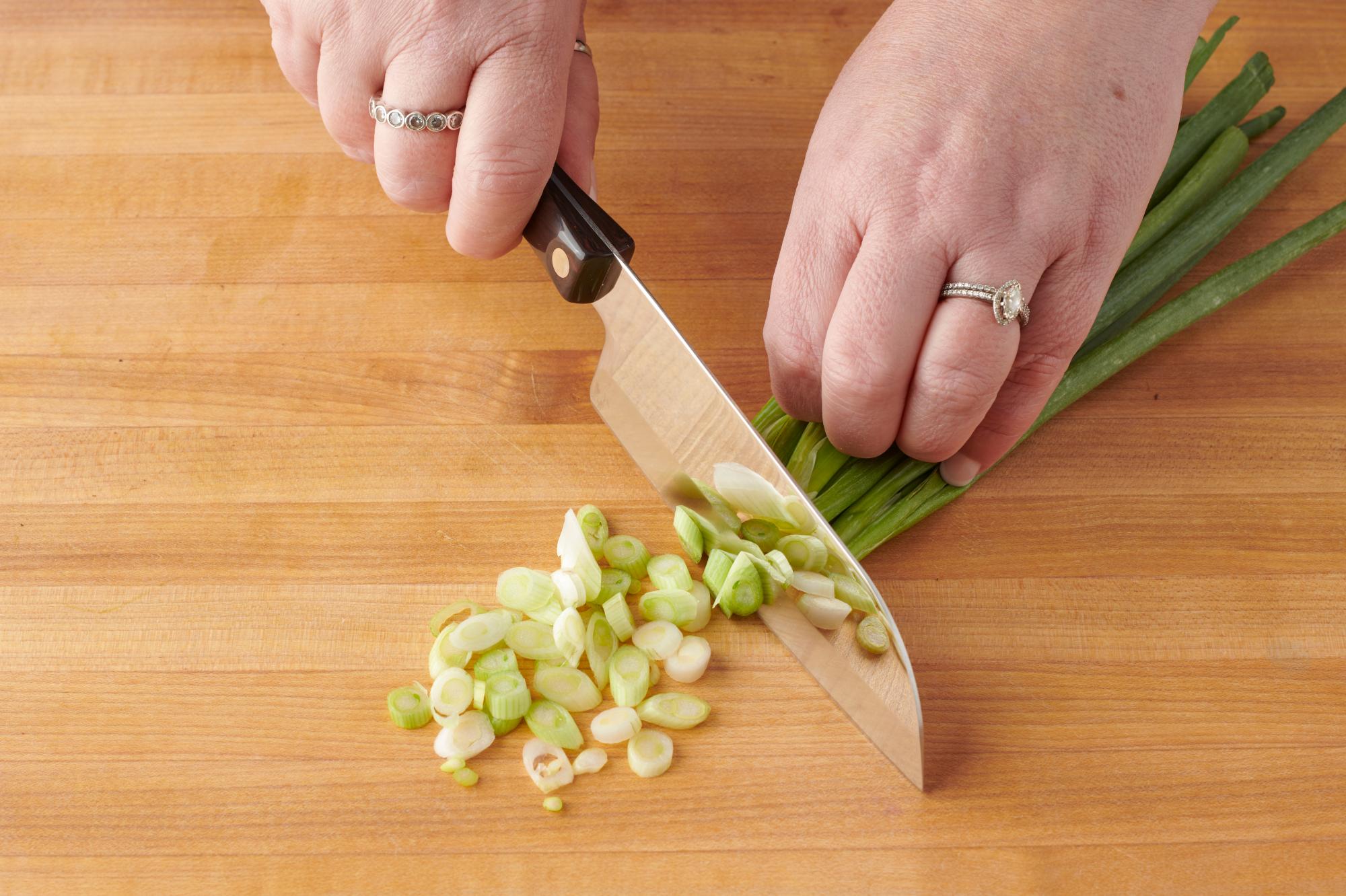 Slicing green onions with a Petite Santoku.