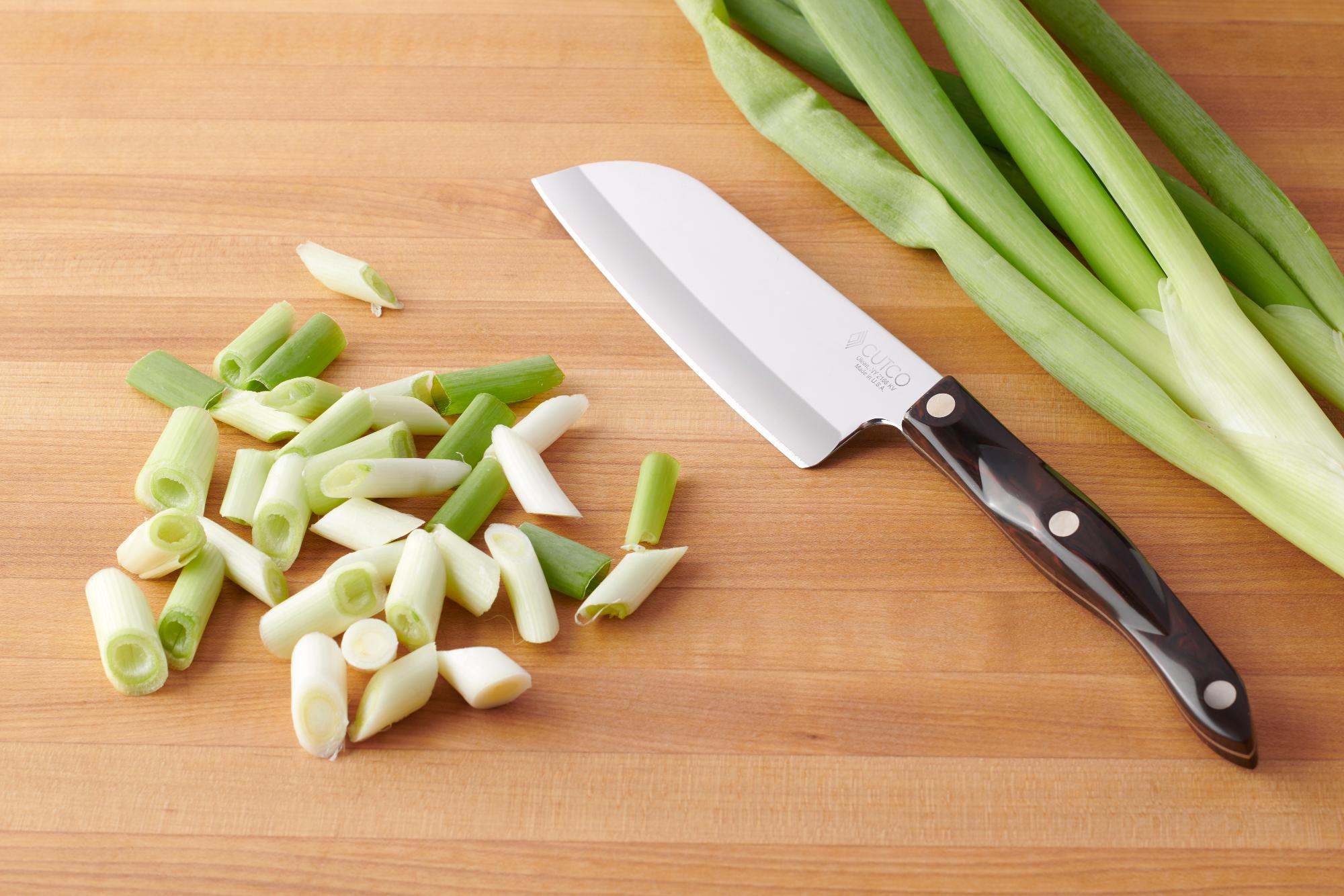 Use the Petite Santoku to slice the green onions.