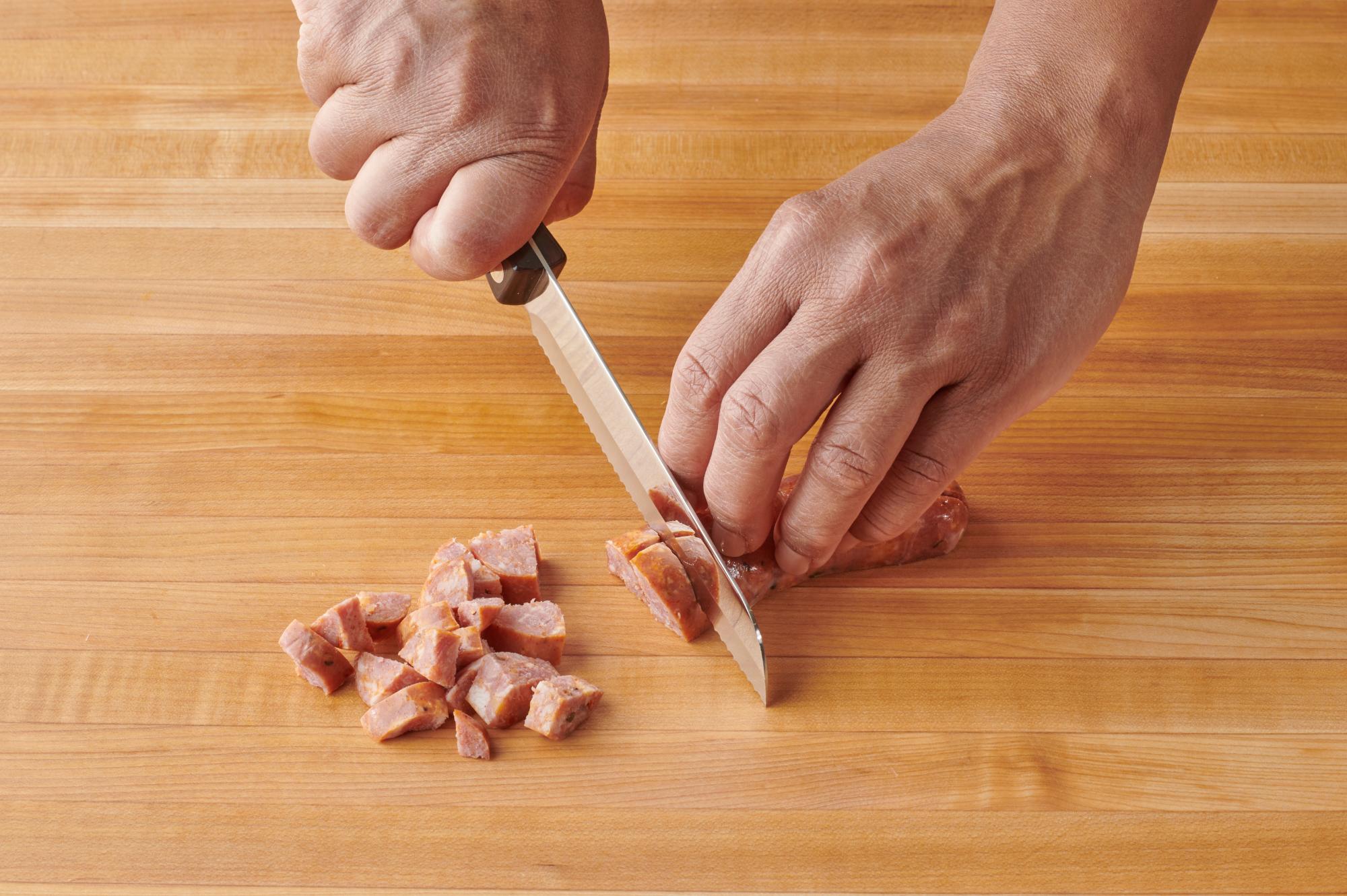 Cubing the sausage with a Santoku-Style Trimmer.