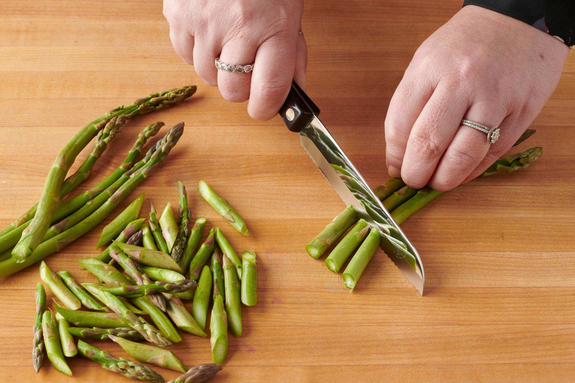 Cutting asparagus with the Santoku-Style Trimmer.