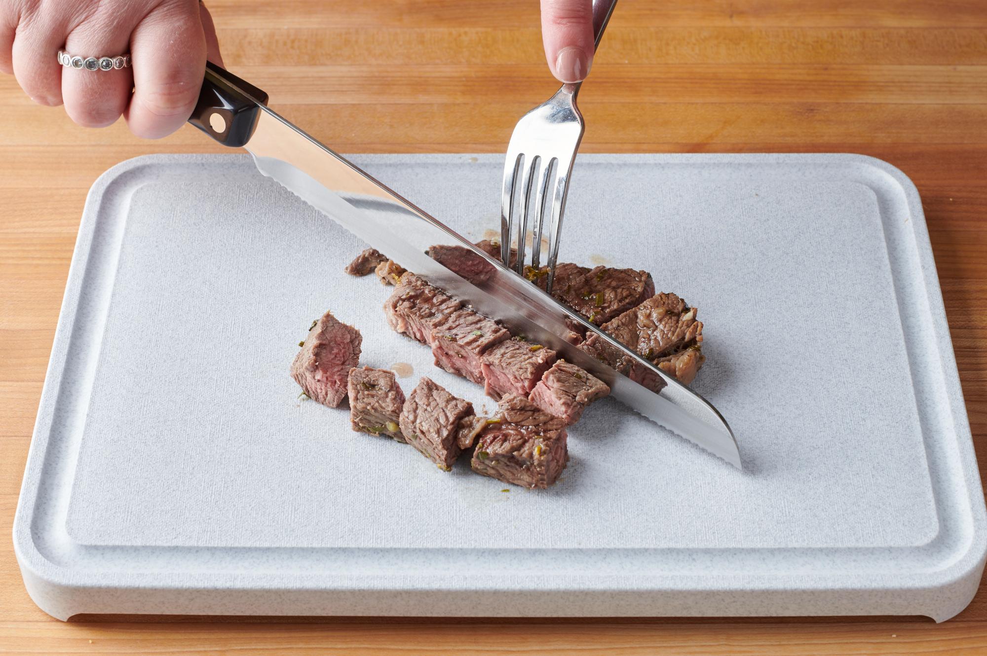 Slicing the steak with a Santoku-Style 8 inch Carving