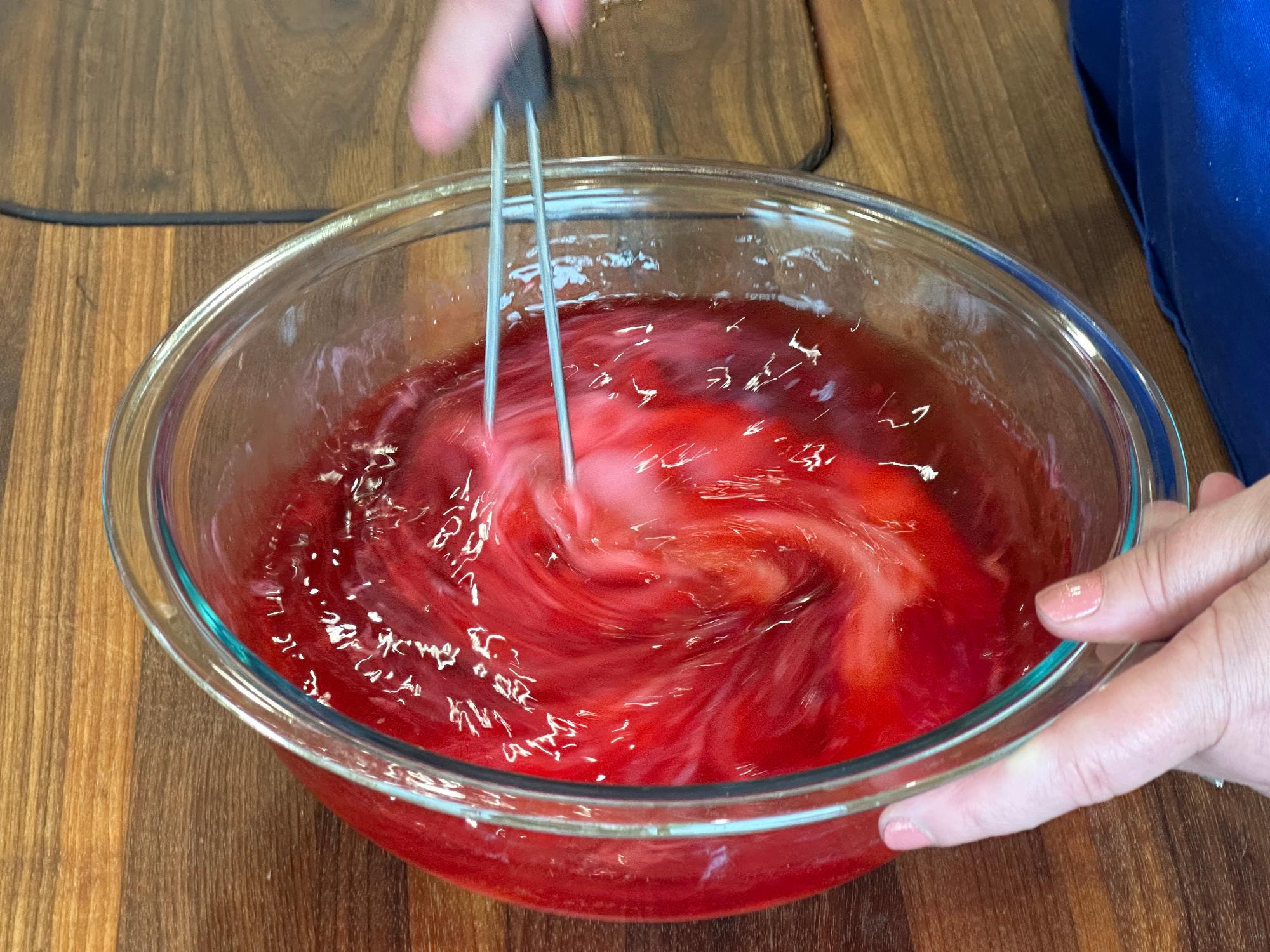 Using a Mix-Stir to whisk in the condensed milk.