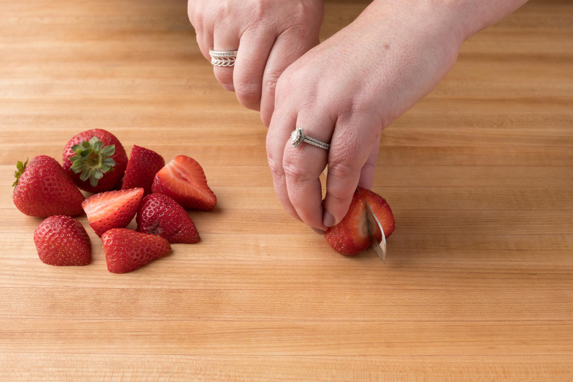 Cutting strawberries with a Santoku-Style Paring Knife.