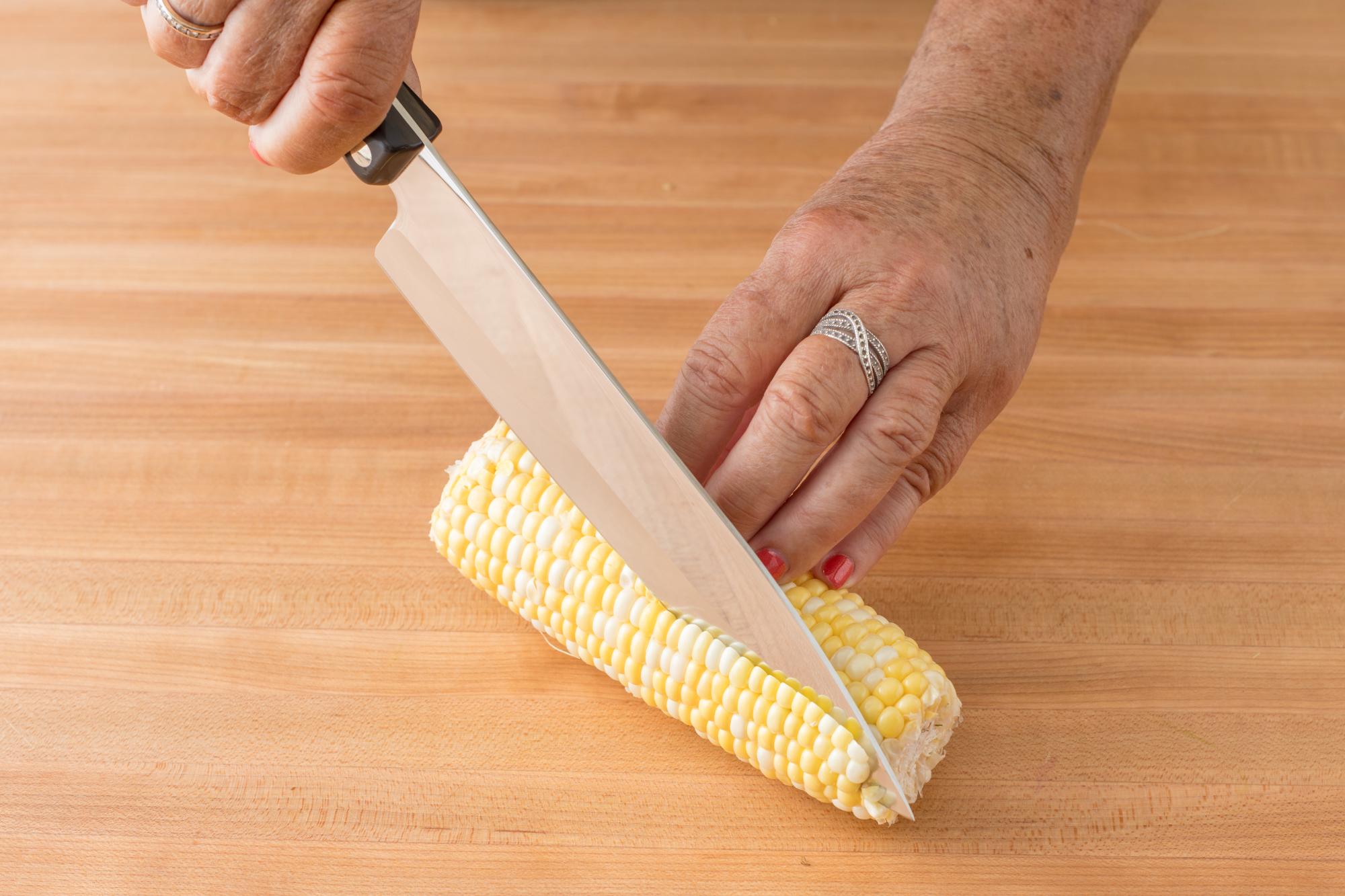 Removing the corn kernels with a Petite Chef.