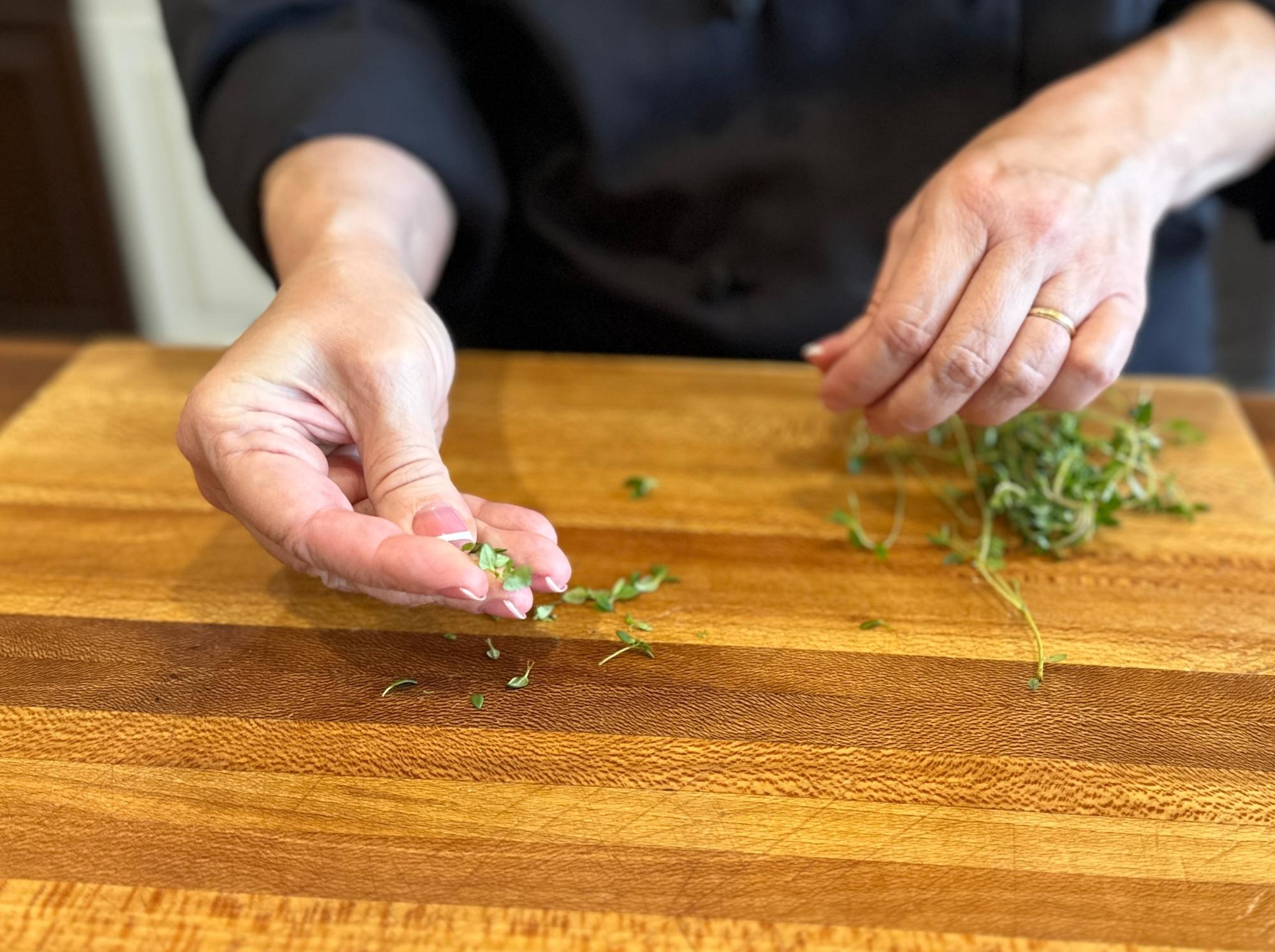 Bruising the thyme.