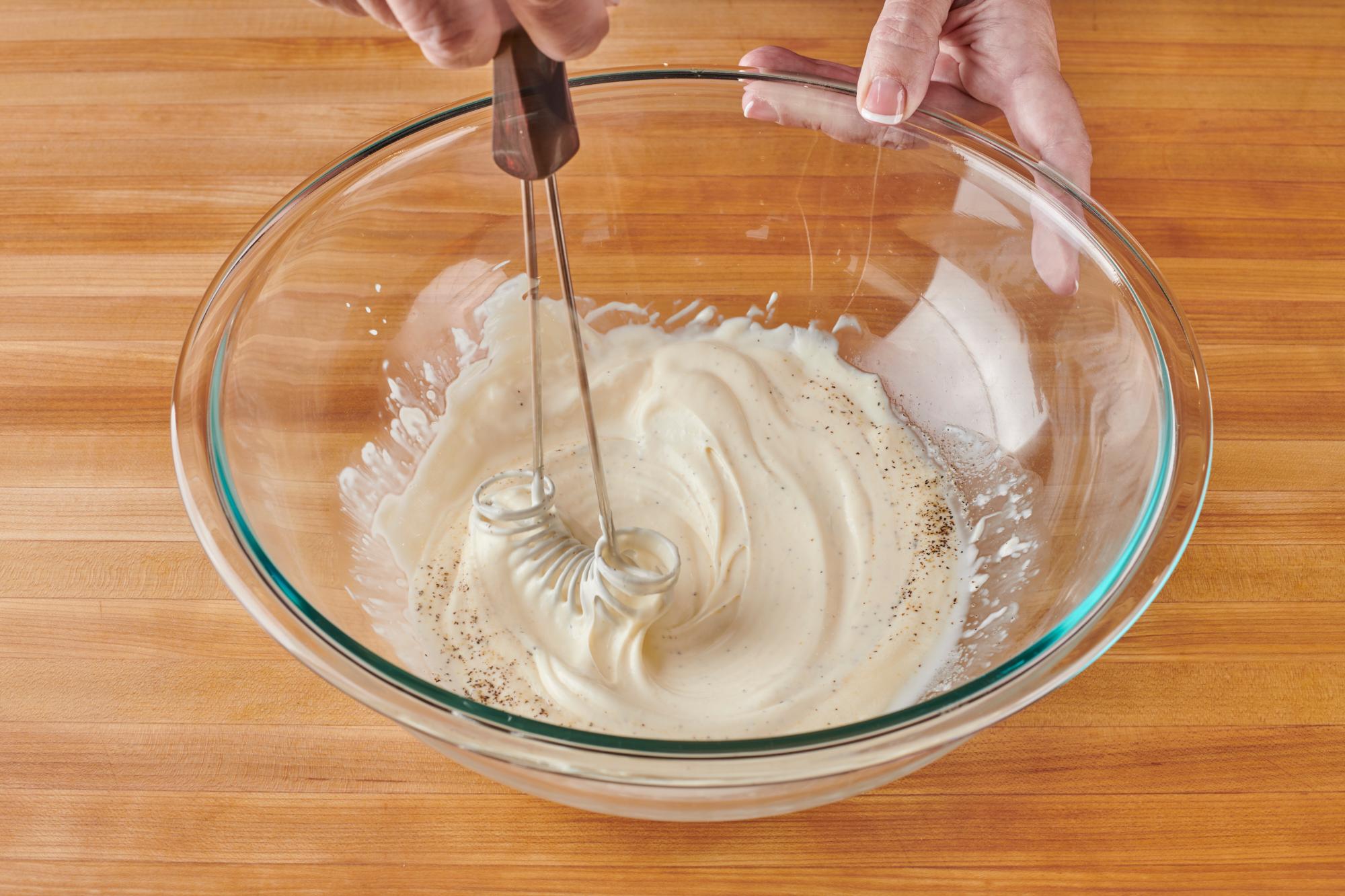 Using a Mix-Stir to whisk the dressing.